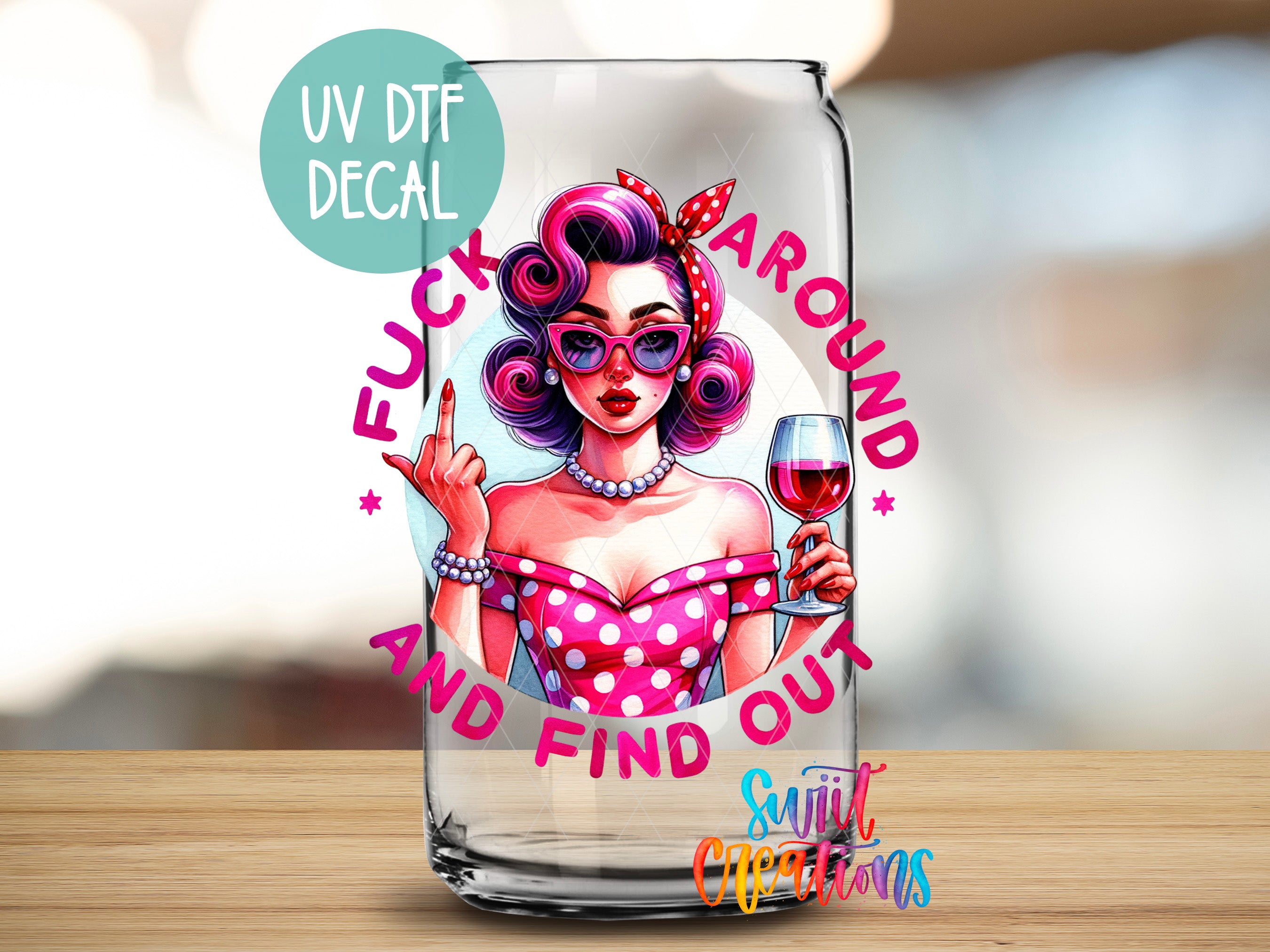 A glass can with a printed design featuring a woman with curly hair, sunglasses, and a polka dot dress, holding a wine glass and making a peace sign. The text around the design reads "FUCK AROUND AND FIND OUT" and "Sunlit Creations".
