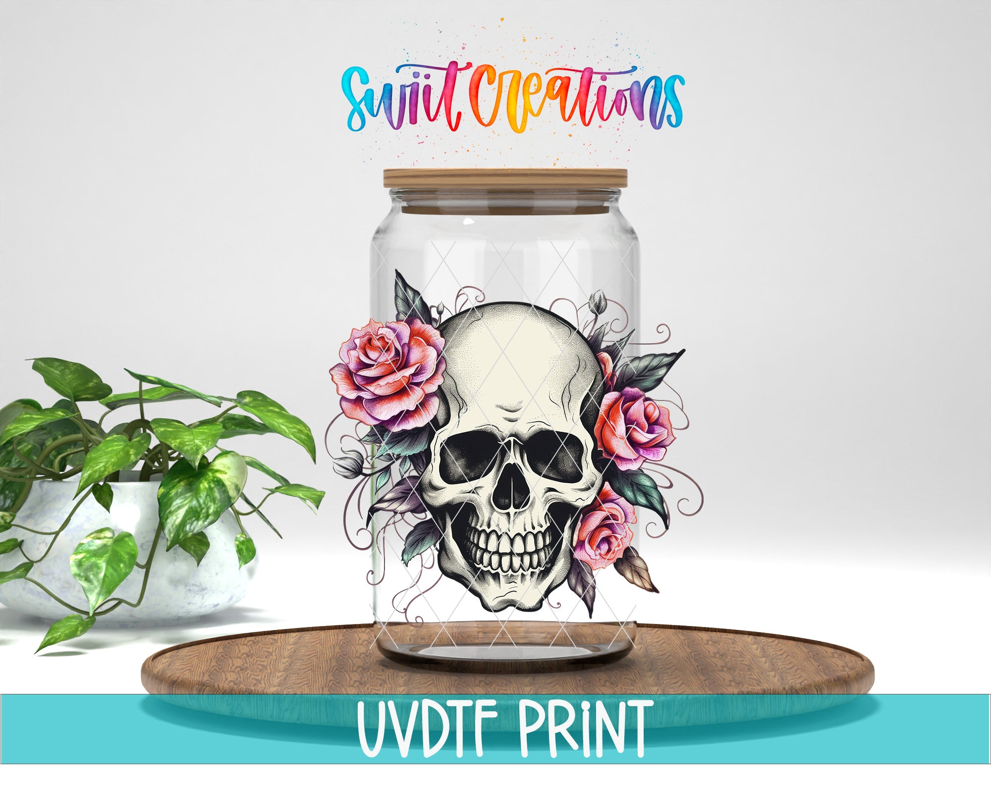 a glass jar with a skull design and floral elements, placed on a wooden surface.