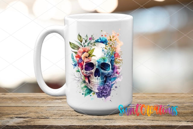 a coffee mug with a skull and flowers on it
