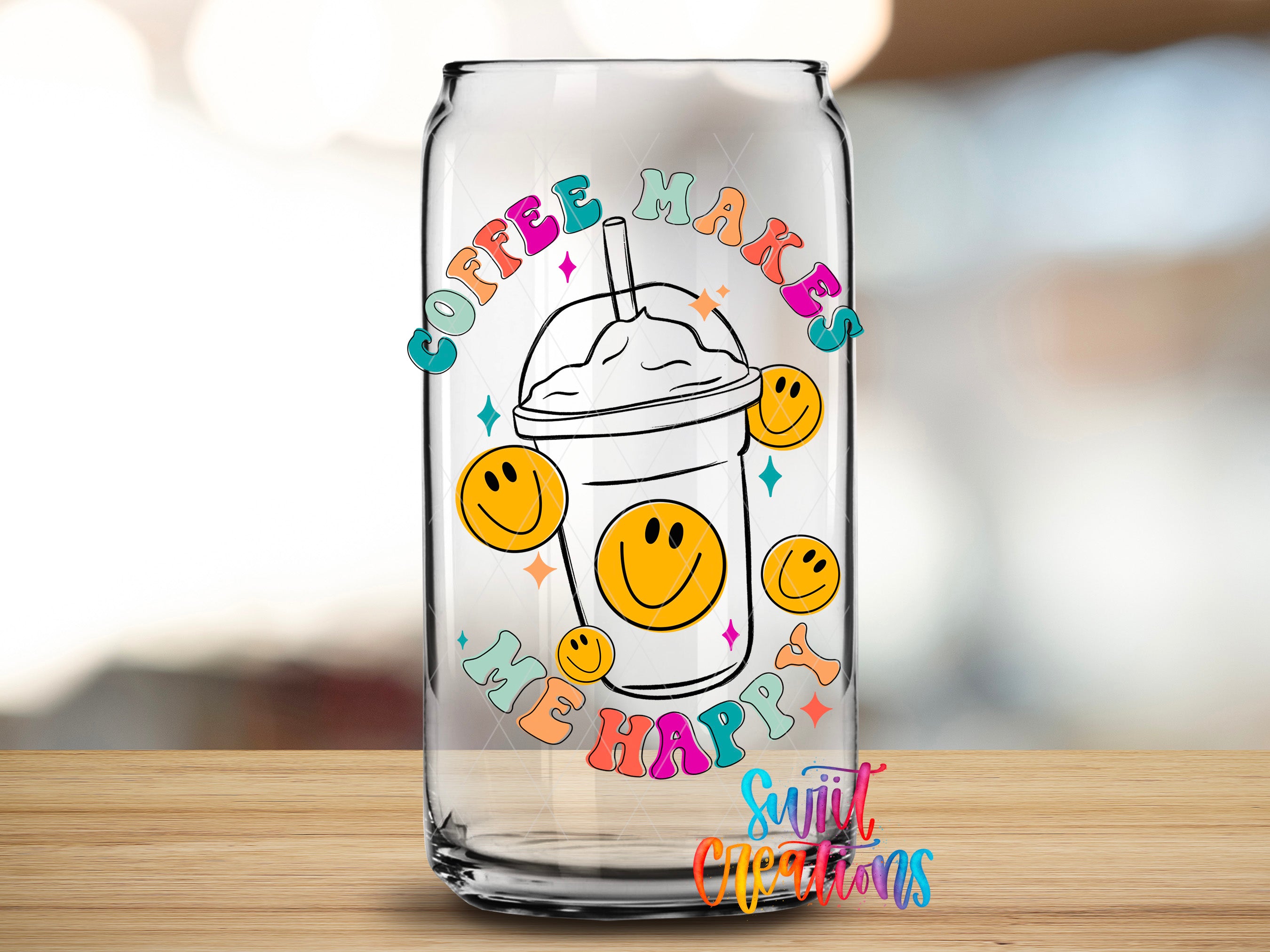 A glass can with a colorful design featuring a coffee cup with a straw and smiley faces, surrounded by the text "COFFEE MAKES ME HAPPY".