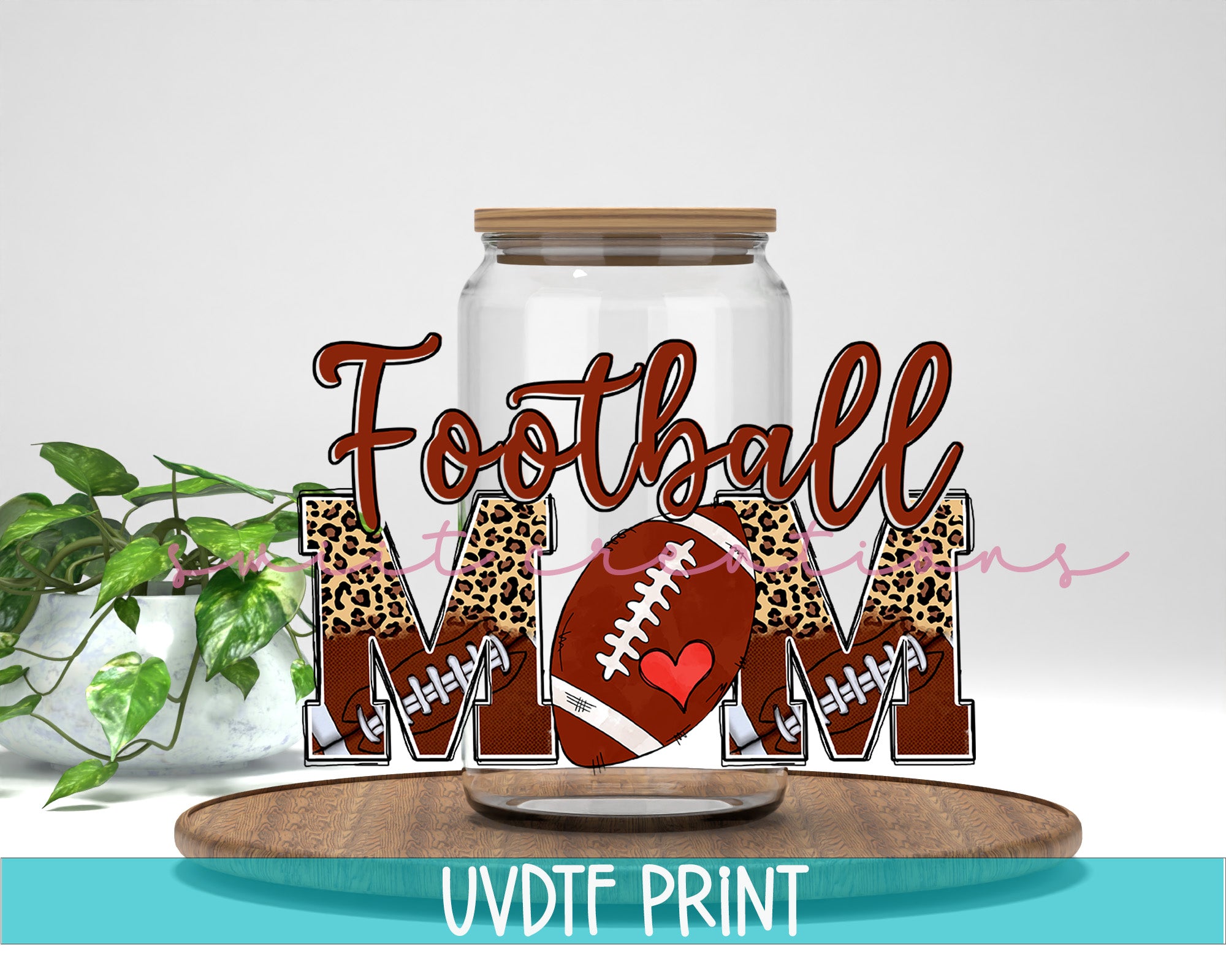 a mason jar with a football and leopard print on it
