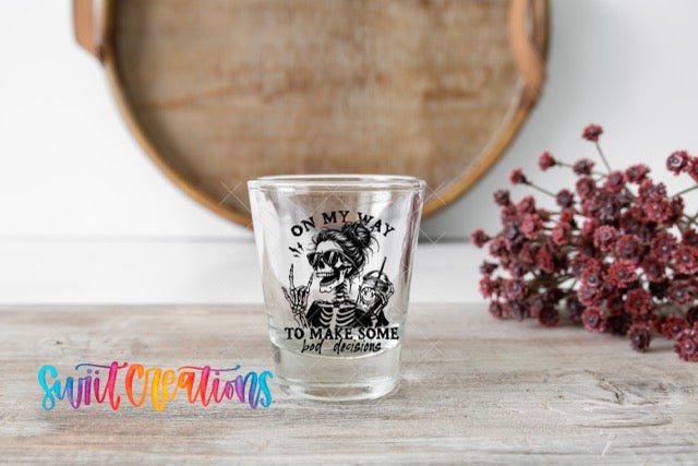 a shot glass sitting on top of a wooden table