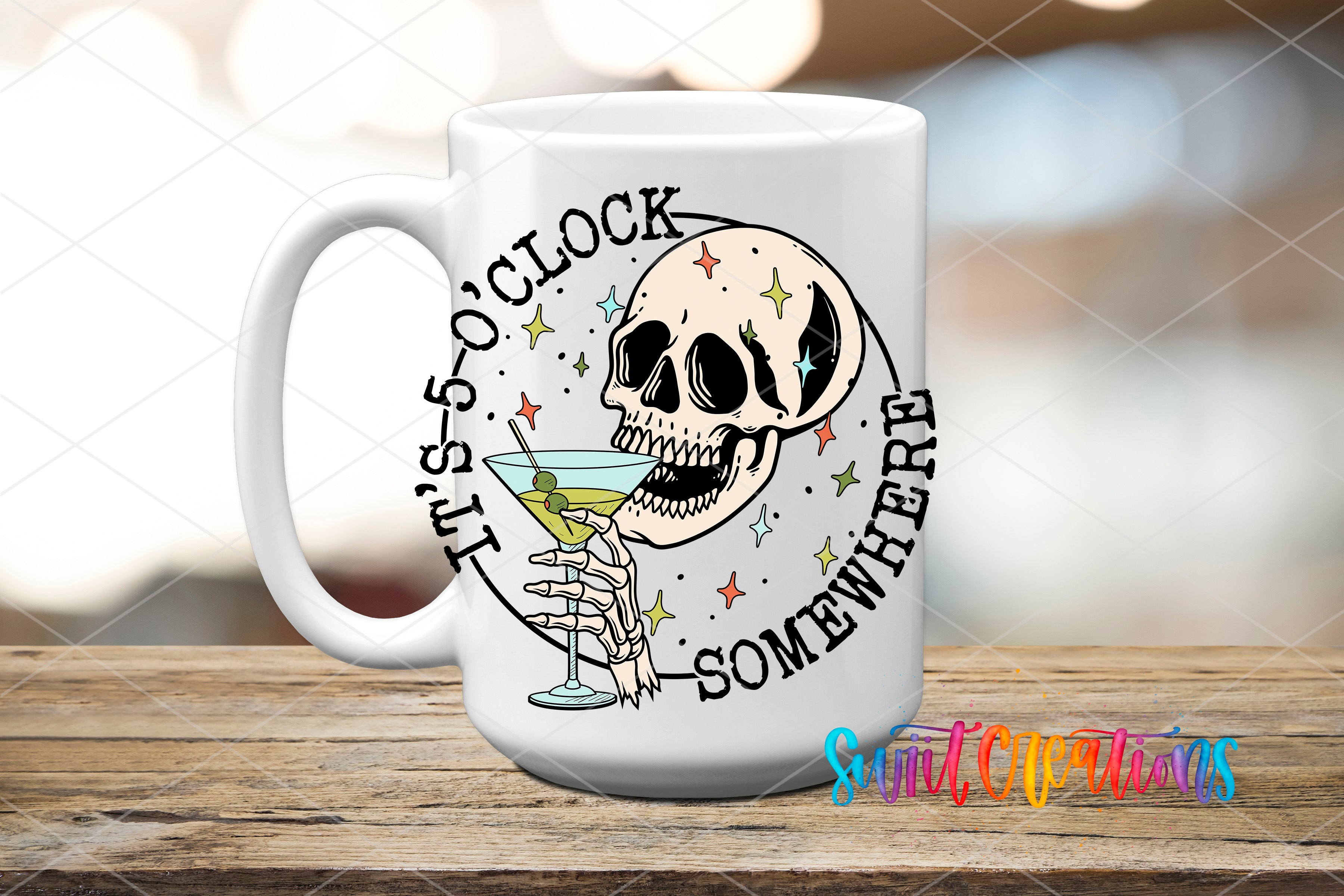 A white ceramic mug with a skull design and the text "It's 5 o'clock somewhere" printed on it.