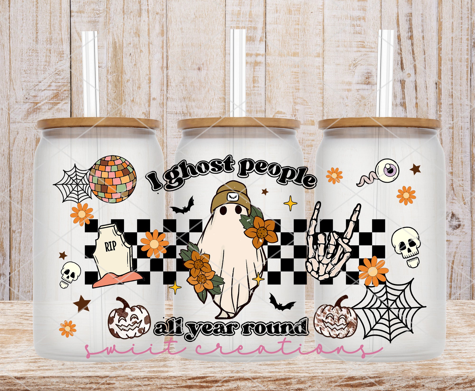 two white coffee mugs with halloween images on them