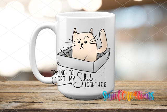 a white coffee mug with a cat inside of it