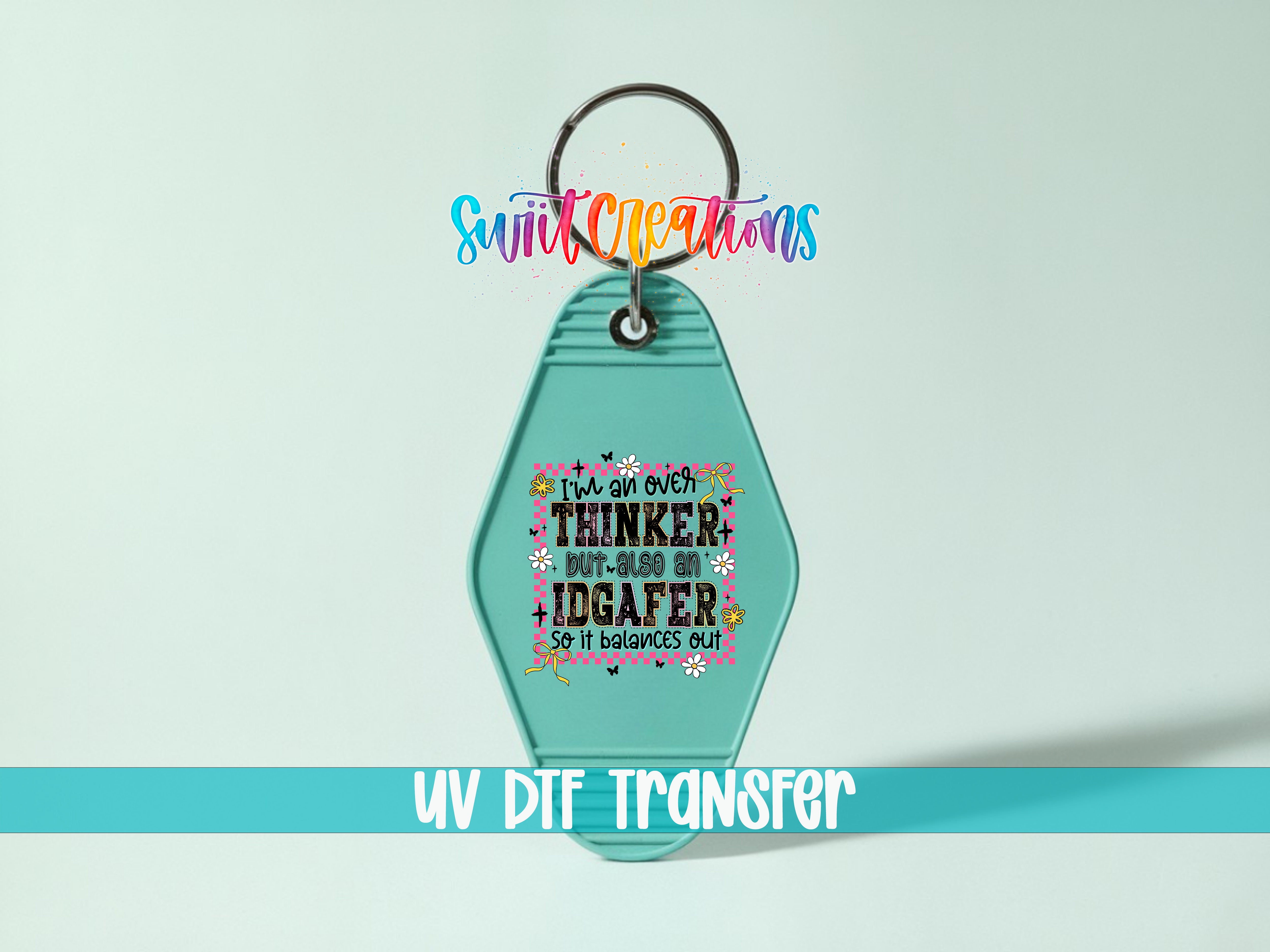A keychain with a colorful design and text on it, along with a UV DIF Transfer label.