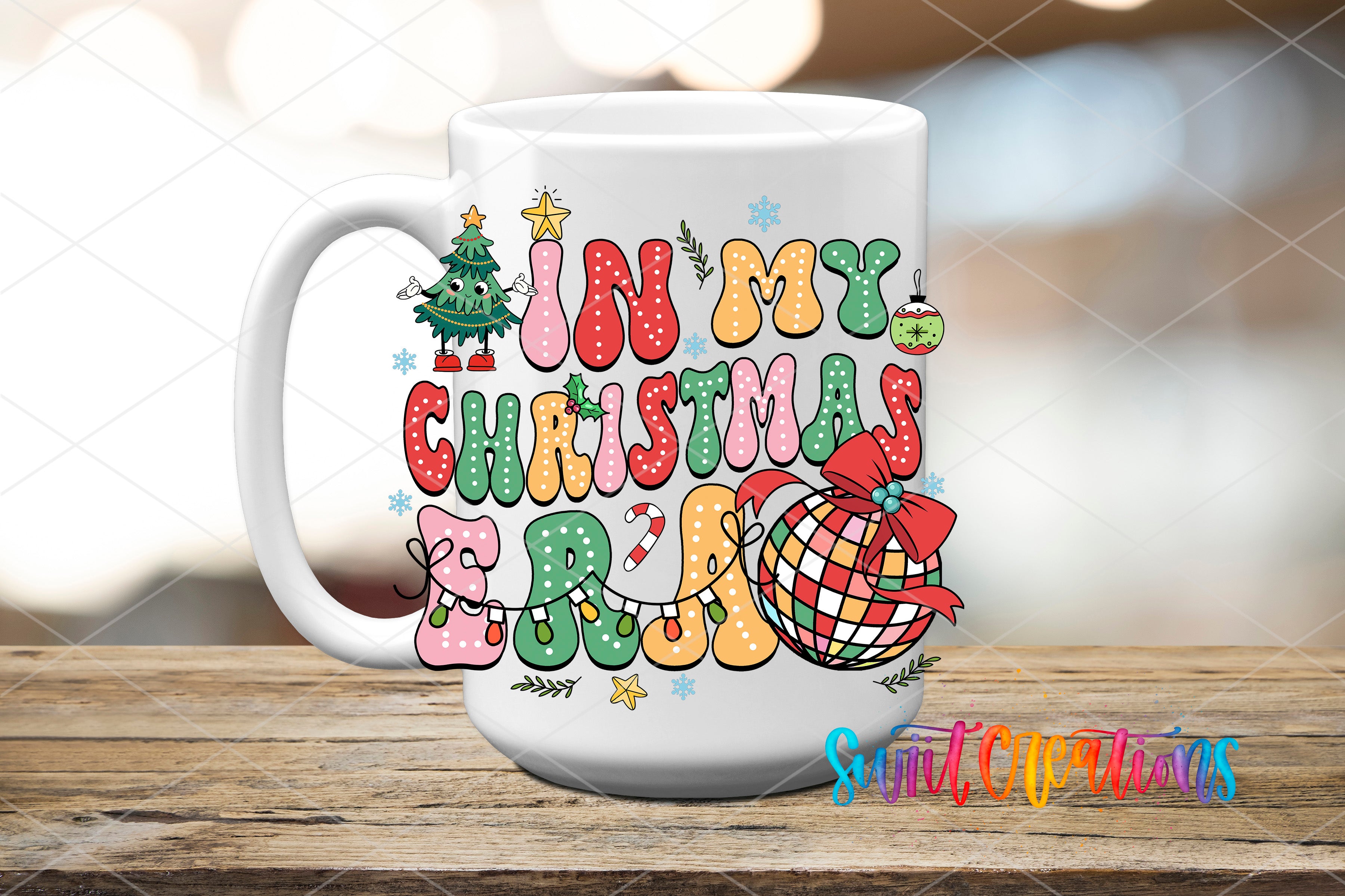 A white mug with a colorful, festive design featuring Christmas-themed text and decorations, such as a Christmas tree, snowflakes, and a ball.