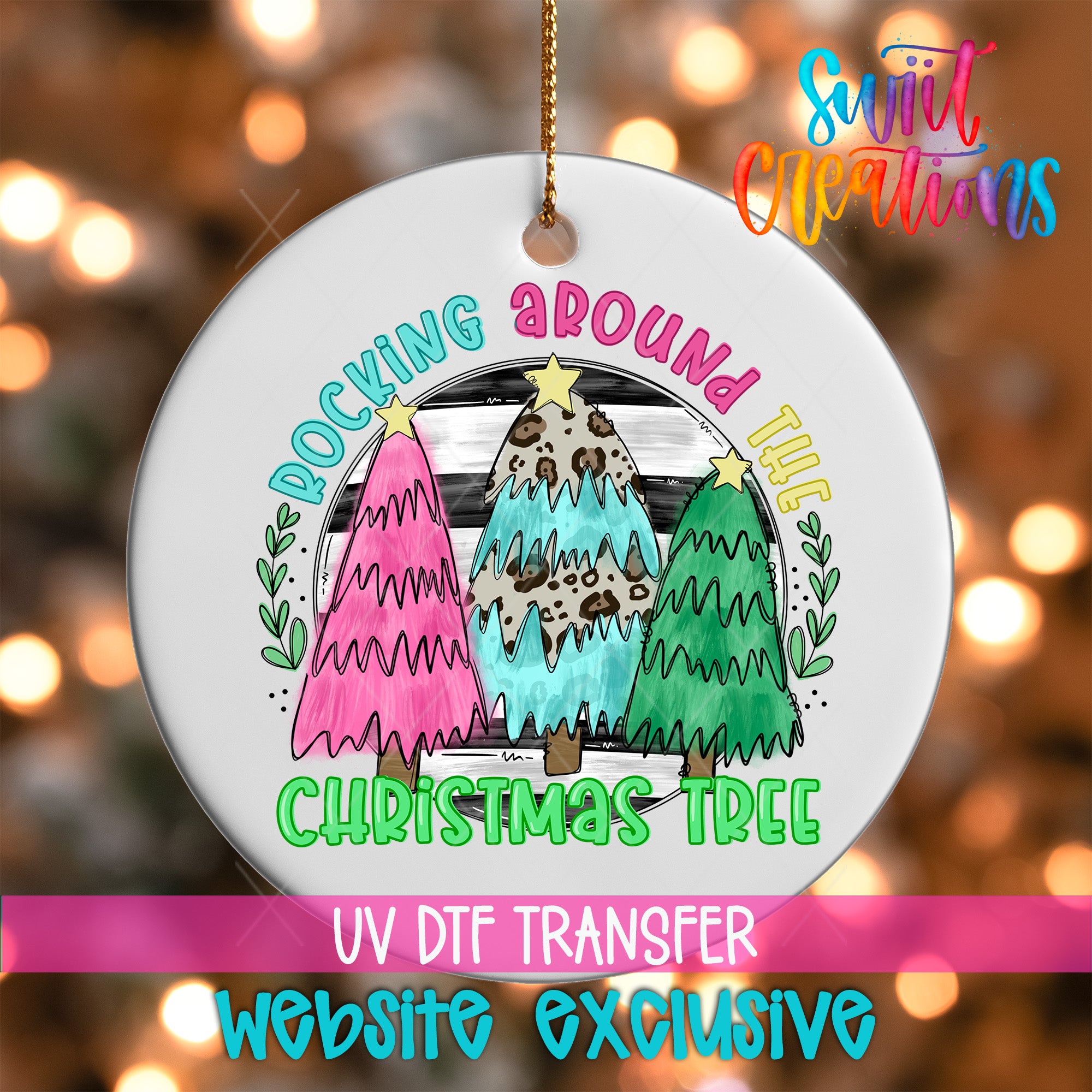A white Christmas tree ornament with a colorful design featuring three stylized Christmas trees and the text "Rocking around the Christmas tree" in a decorative font.