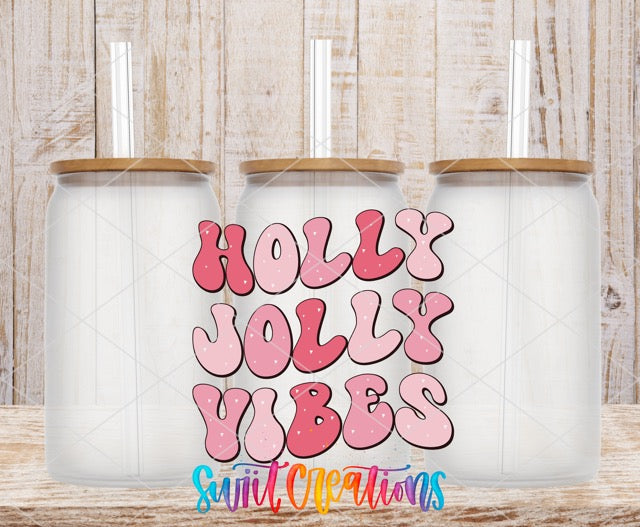 two coffee mugs with the words holly jolly vibes on them