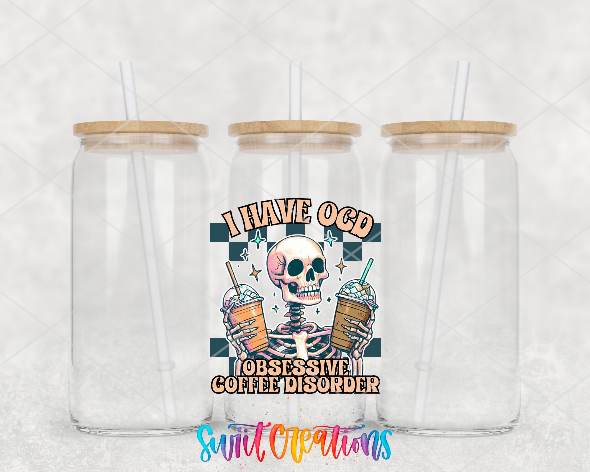 two clear tumblers with a skull on the side