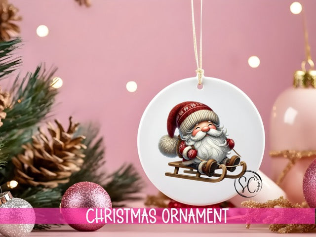 a christmas ornament with a santa clause riding a sleigh