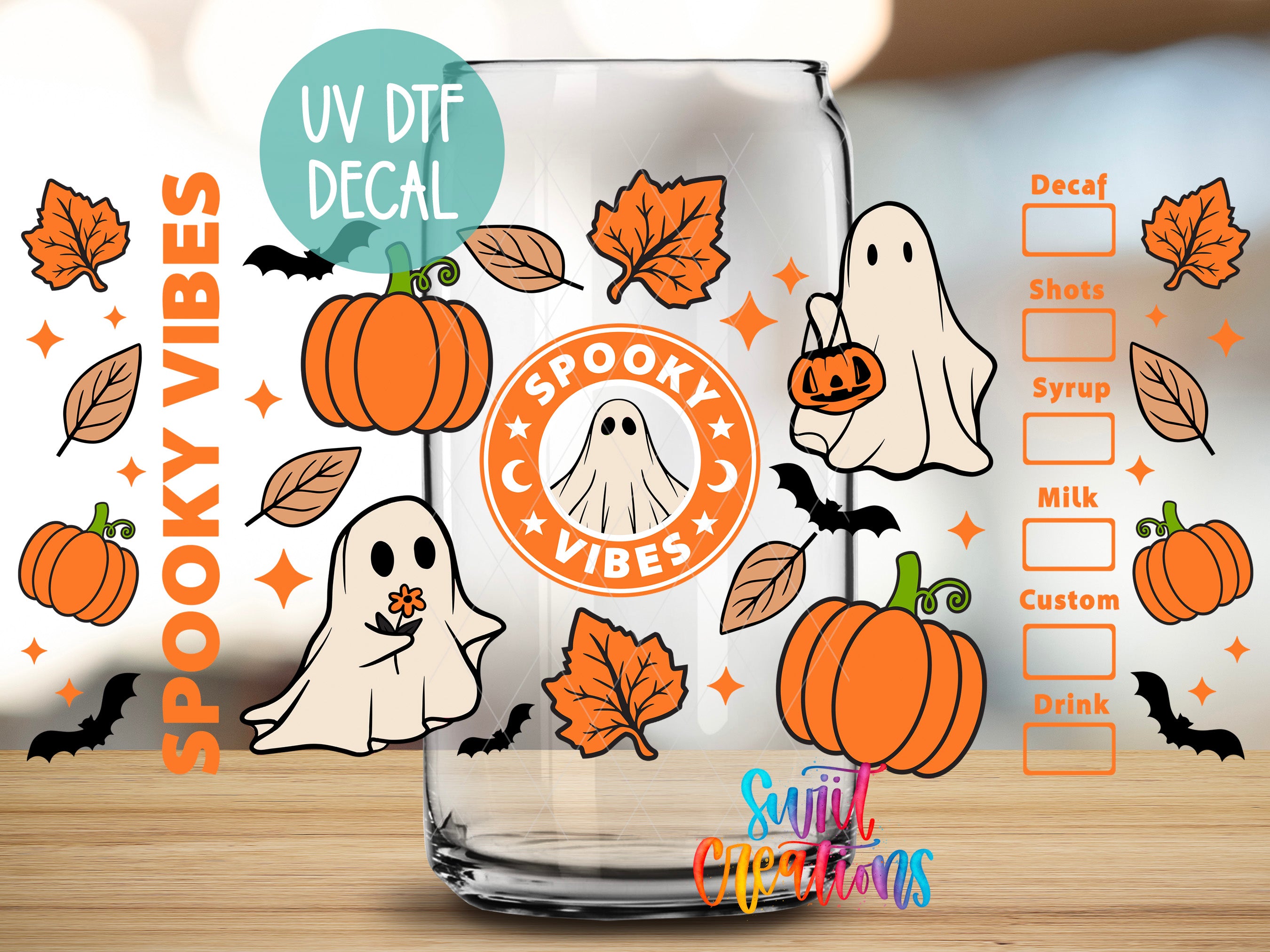 a Halloween-themed decal on a glass, with illustrations of pumpkins, bats, and ghostly figures.
