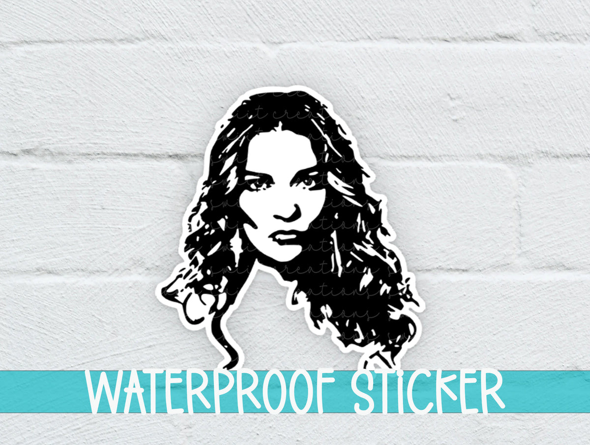 Alexis Portrait sticker on a white brick background with a waterproof sticker banner