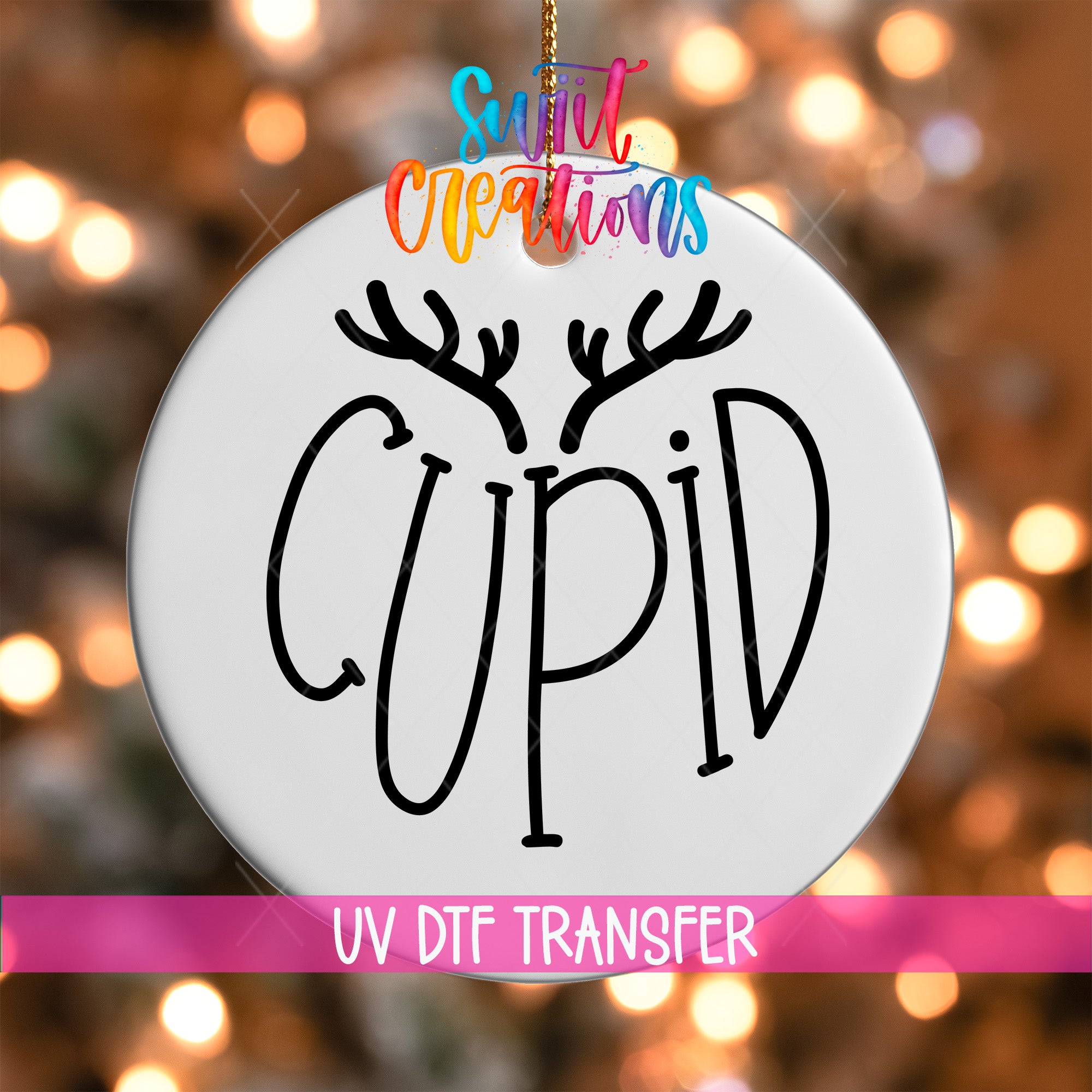 A white ornament with the word "CUPID" written on it, hanging against a background of colorful lights.