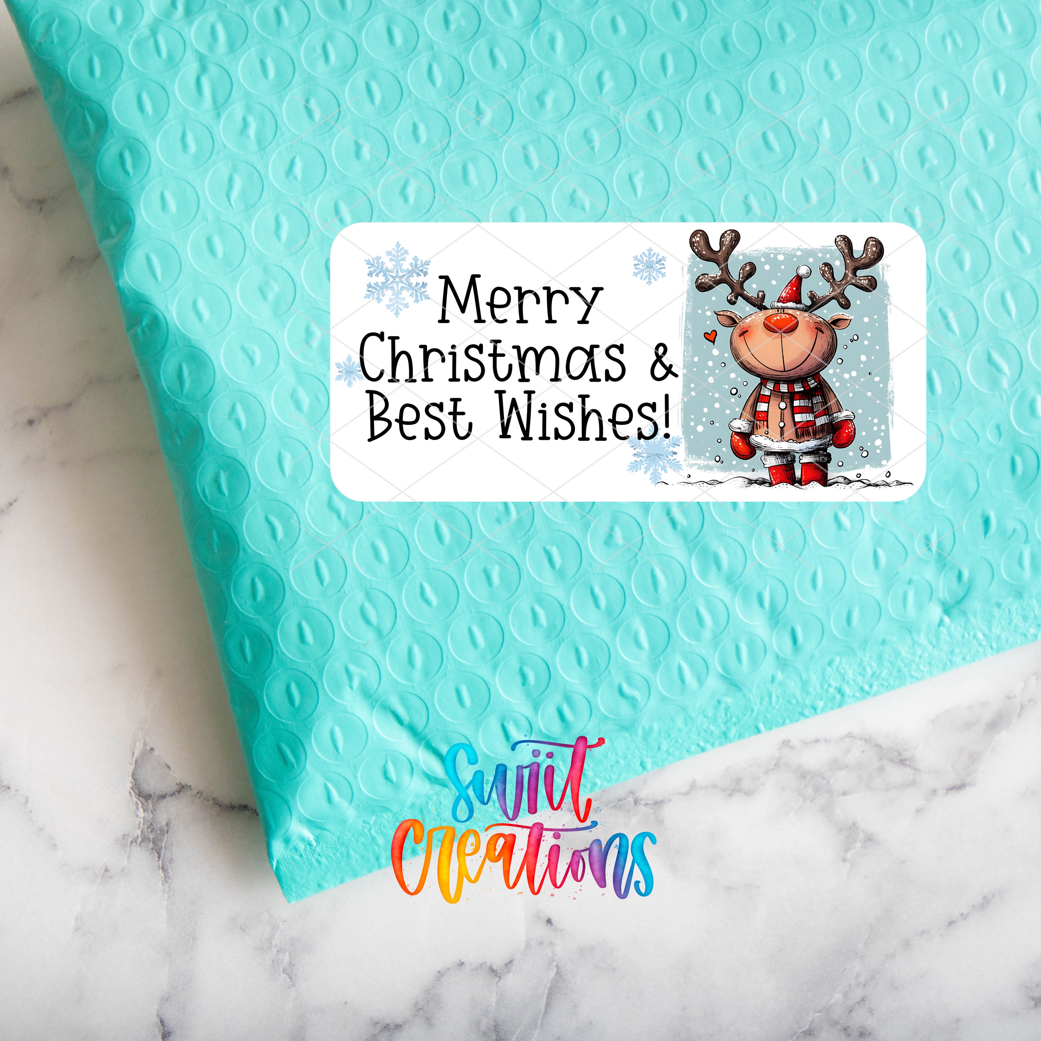 a blue envelope with a reindeer sticker on it