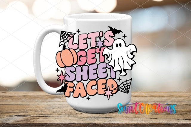 a white coffee mug with a ghost on it