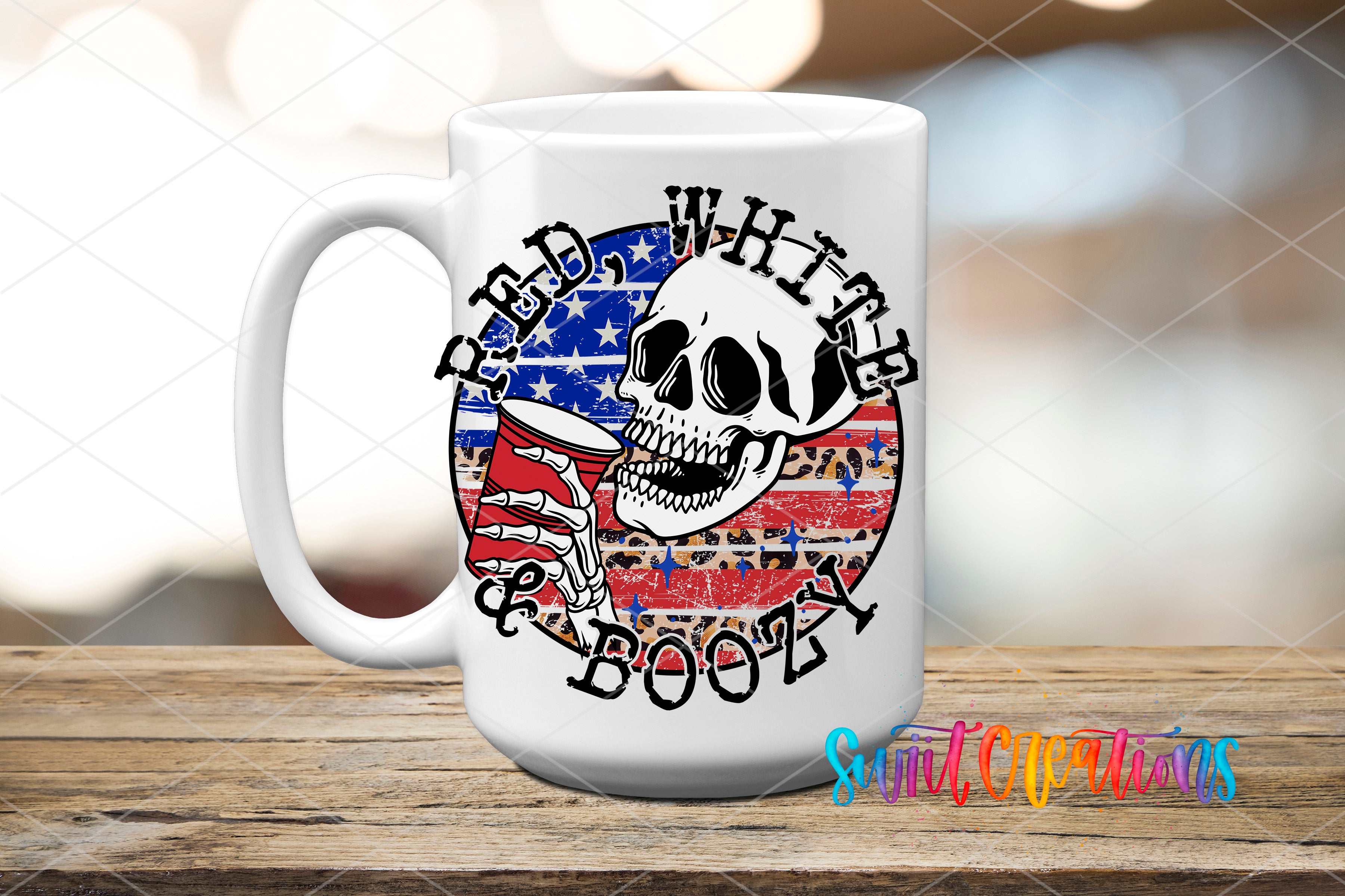 A white mug with a skull design and the text "RED WHITE BOOPY" printed on it, placed on a wooden surface.