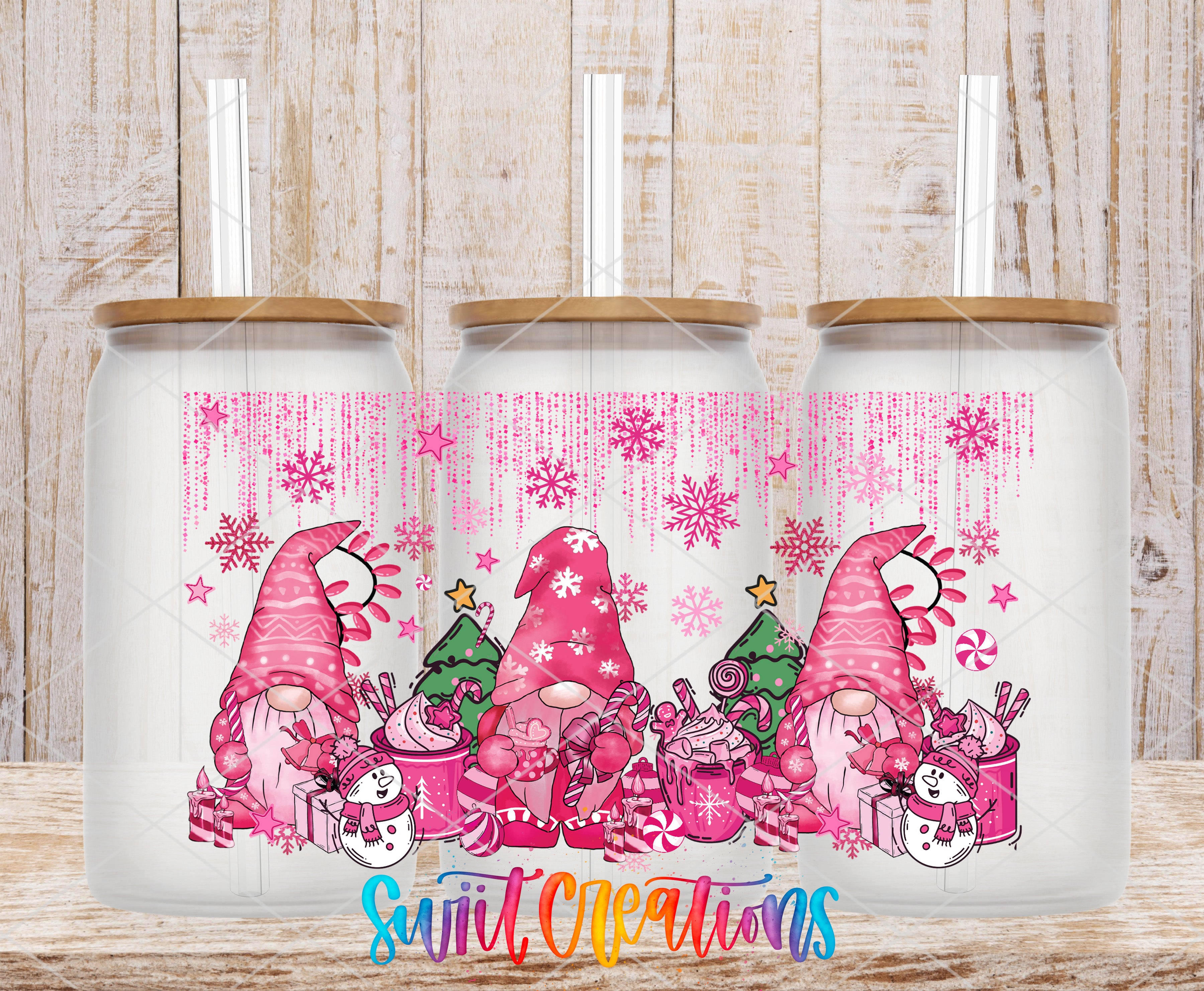 A trio of frosted glass tumblers with a festive pink and white Christmas-themed design featuring gnomes, snowflakes, and candy canes.