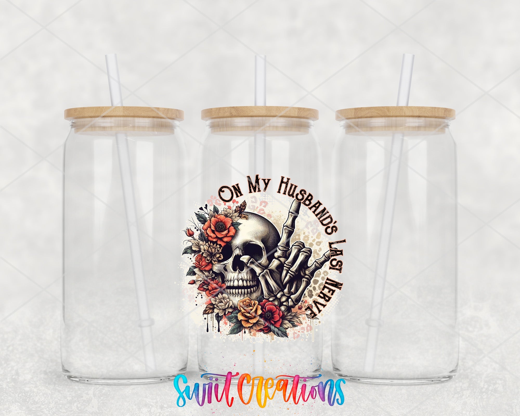 two clear tumblers with a skull and flowers on them