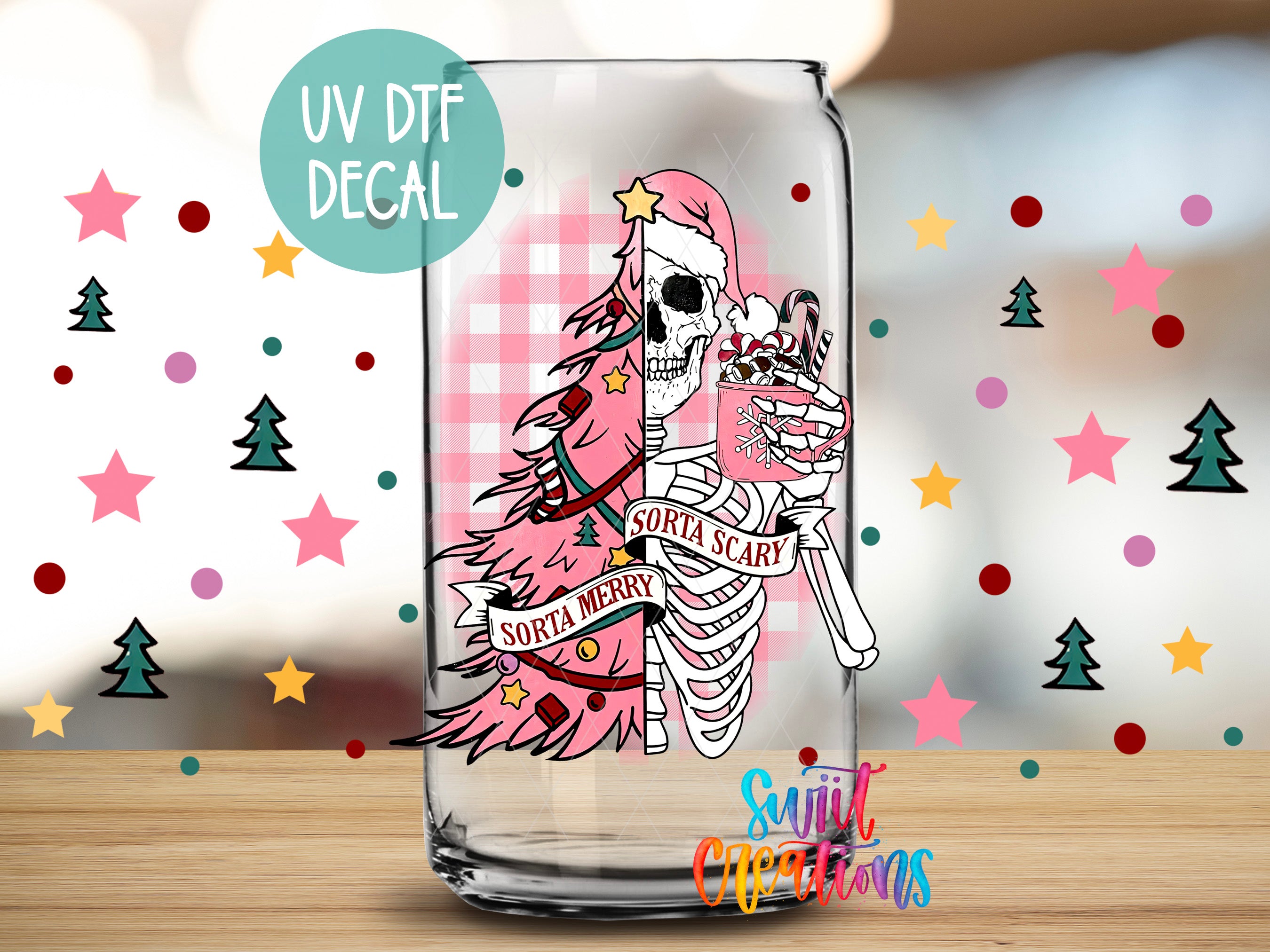 A glass can with a colorful, cartoonish illustration of a skeleton wearing a Santa hat and holding a cup of hot chocolate, surrounded by Christmas-themed decorations.