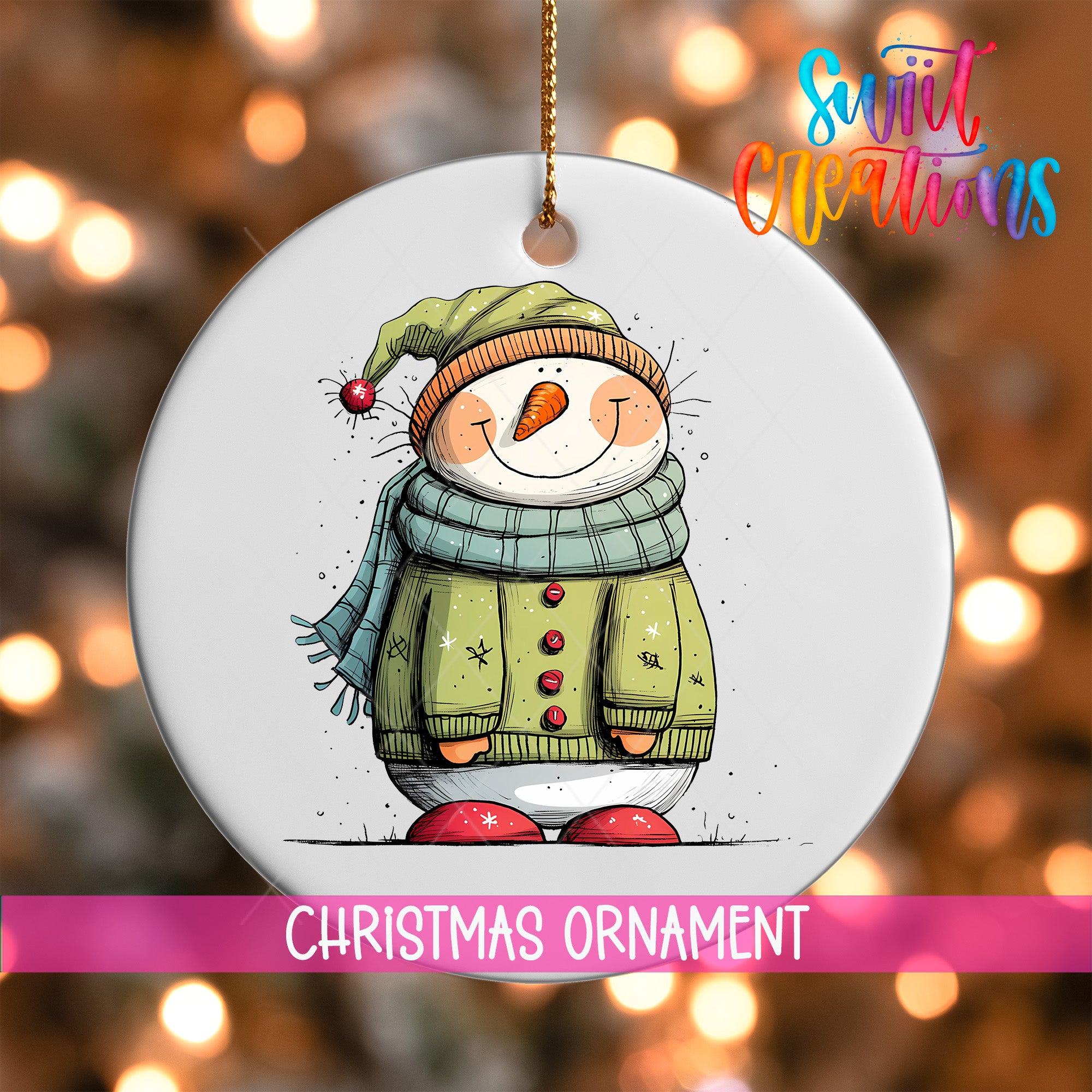 A white Christmas ornament featuring a smiling snowman wearing a green sweater and hat.