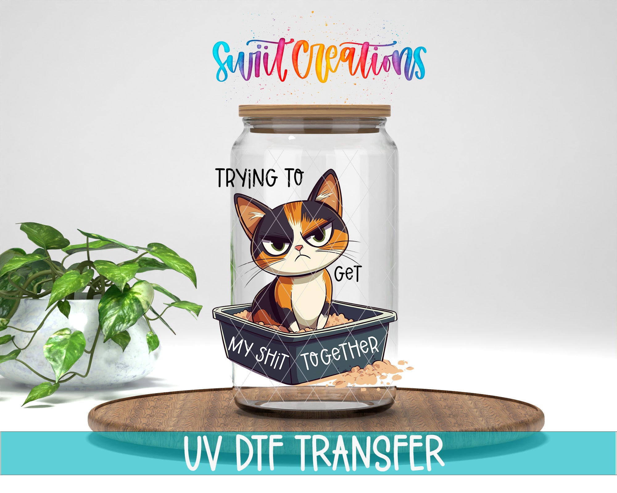 a glass jar with a cartoon cat inside, along with the text "Trying to Get My SHIT TOGETHER" and "UV DFT TRANSFER" printed on it.