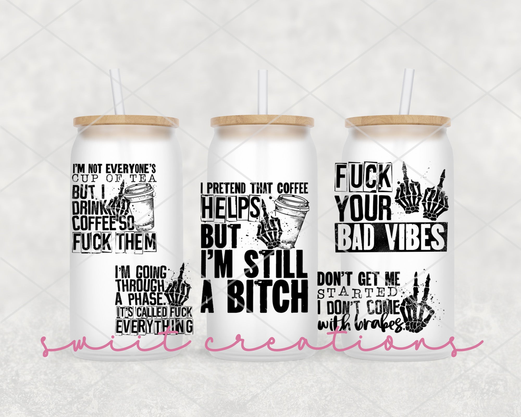 a set of three tumblers with different designs on them