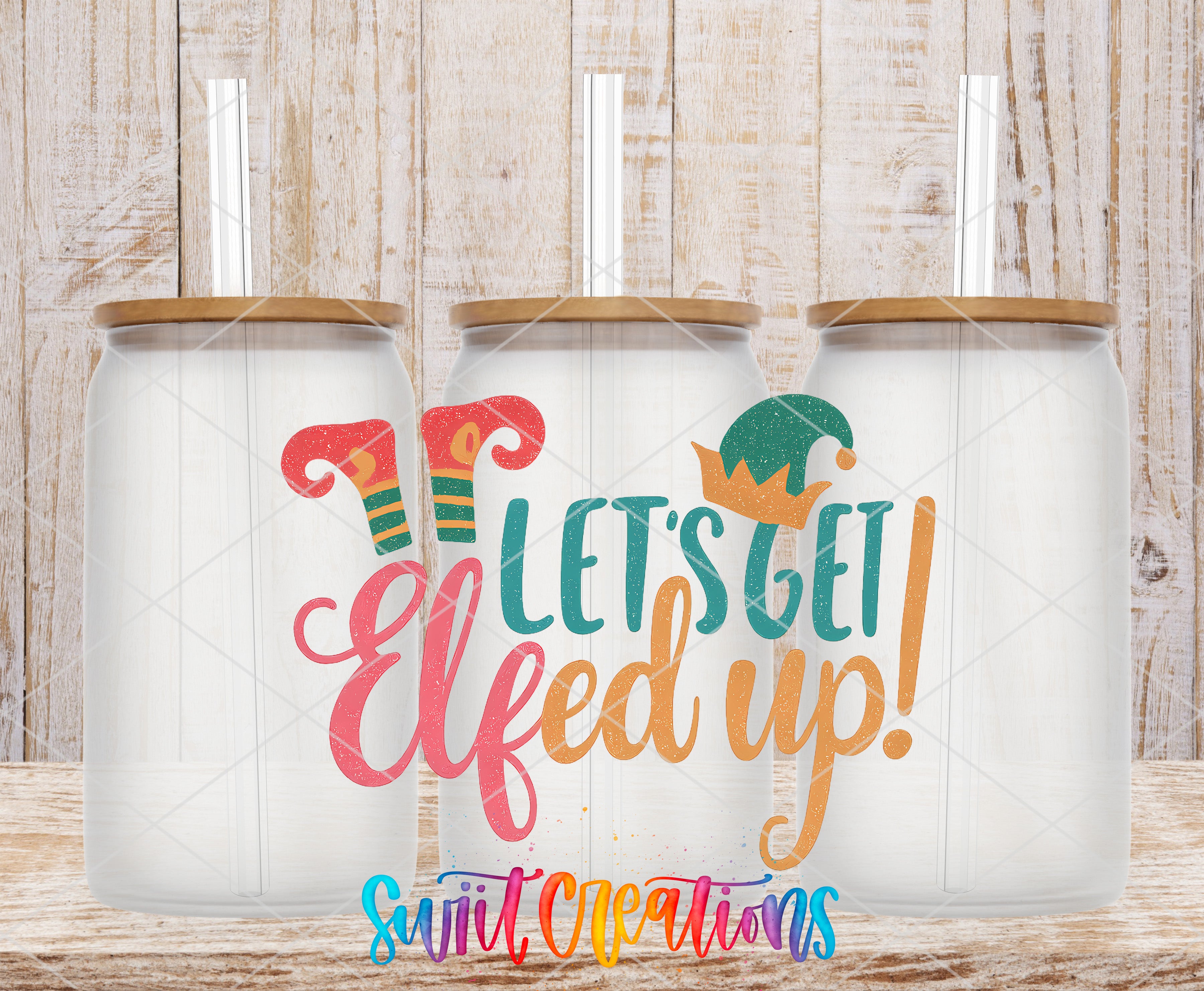 three glass jars with lids, each containing a straw, and the text "Let's get Elfed up!" written on them.