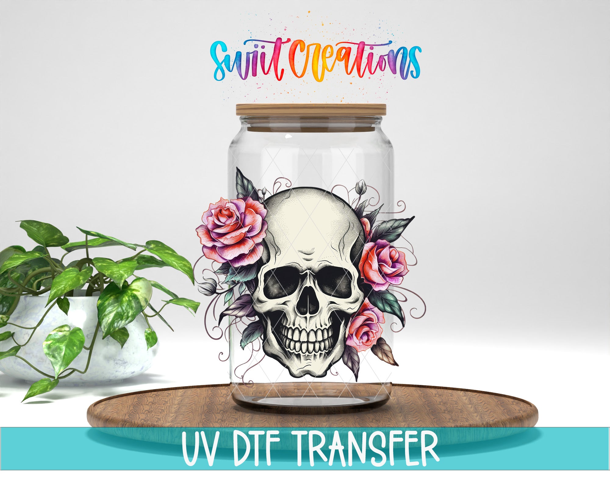 a glass jar with a skull design and floral elements, placed on a wooden surface.