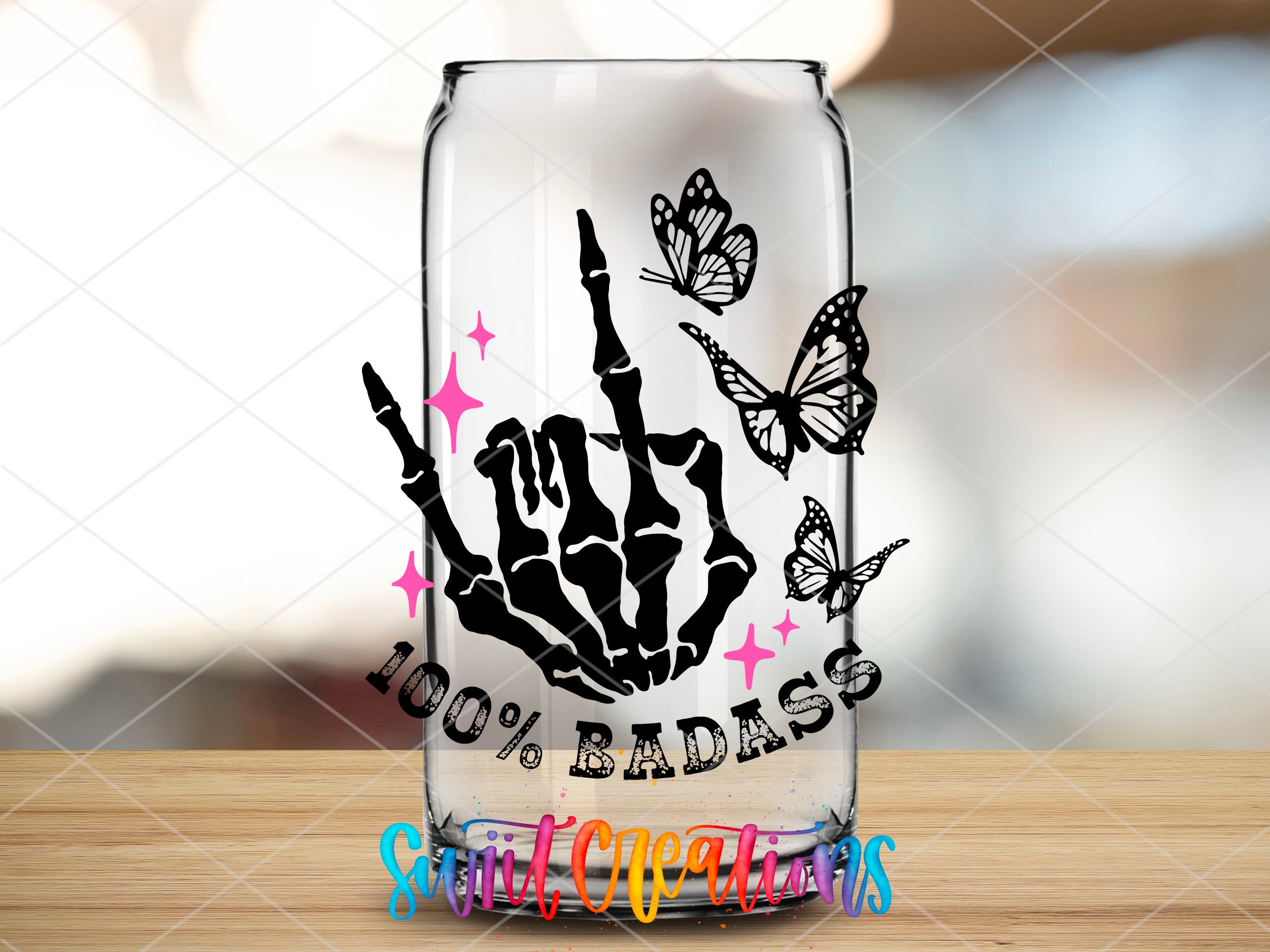 a glass with a hand and butterflies on it