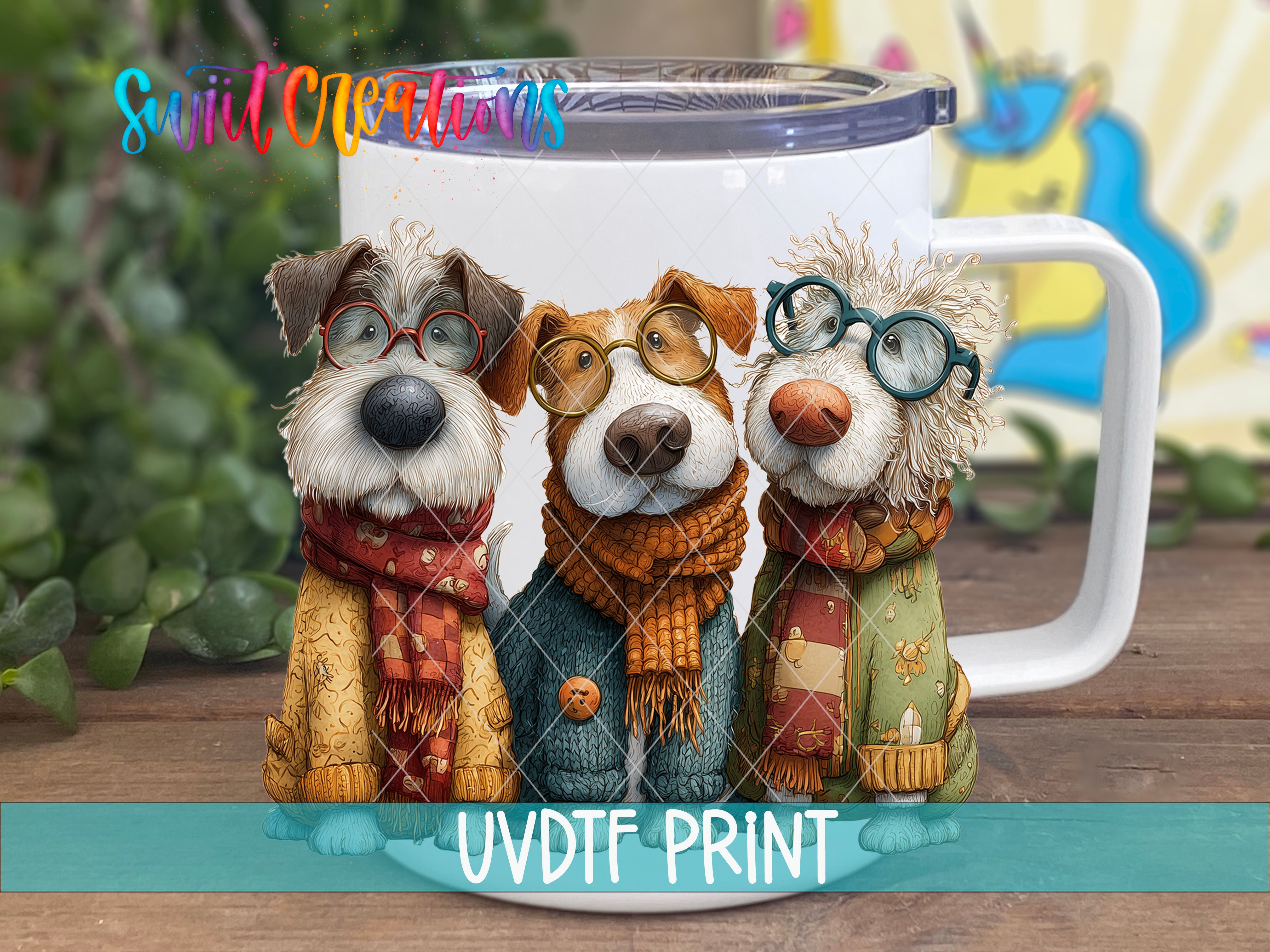 Three whimsical dog figurines wearing glasses and scarves, arranged in a row on a white mug with a colorful background.