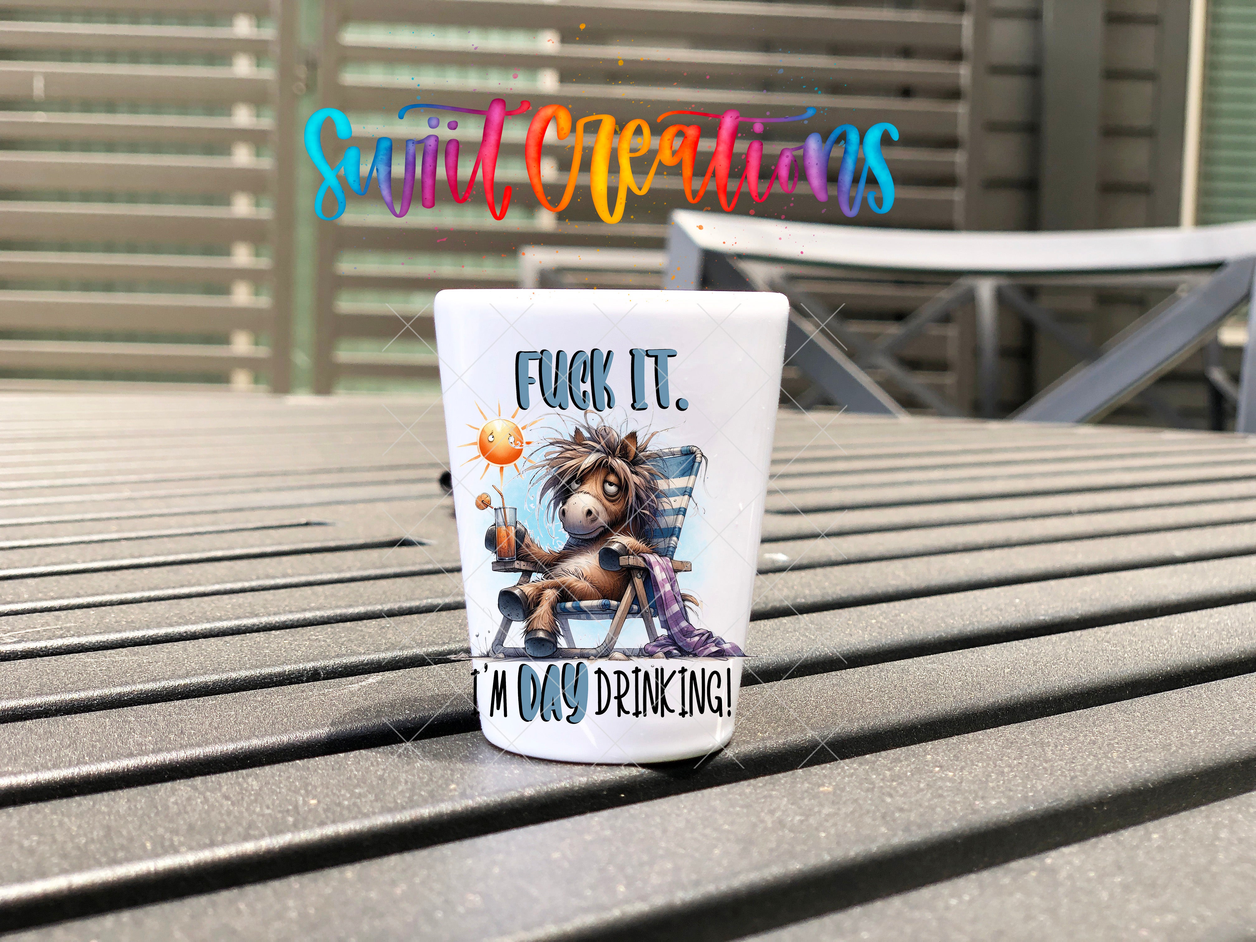a coffee cup sitting on top of a wooden table