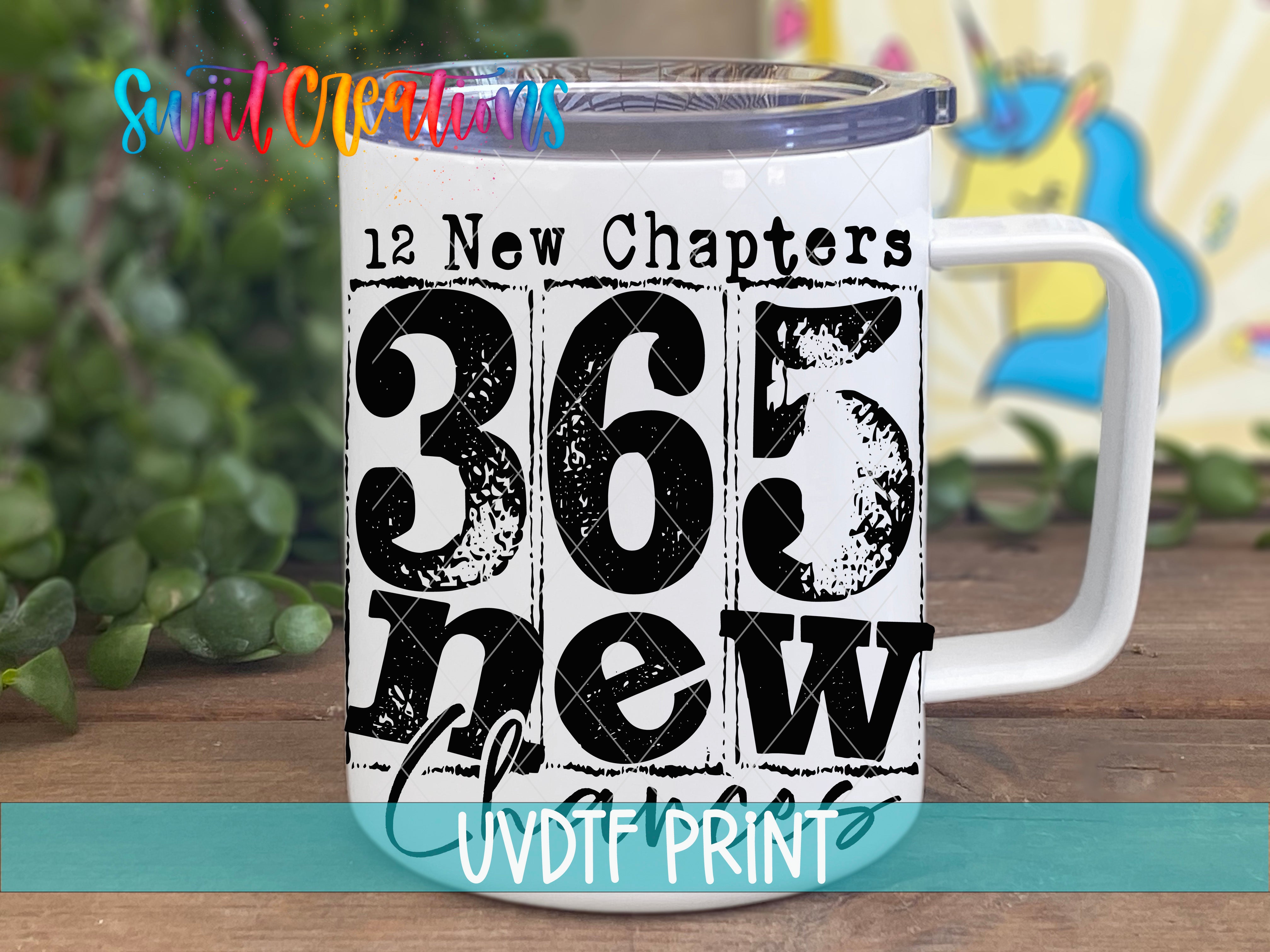 A white mug with the text "365 new chapters" printed on it, along with the number "365" and the word "new" in a distressed font.