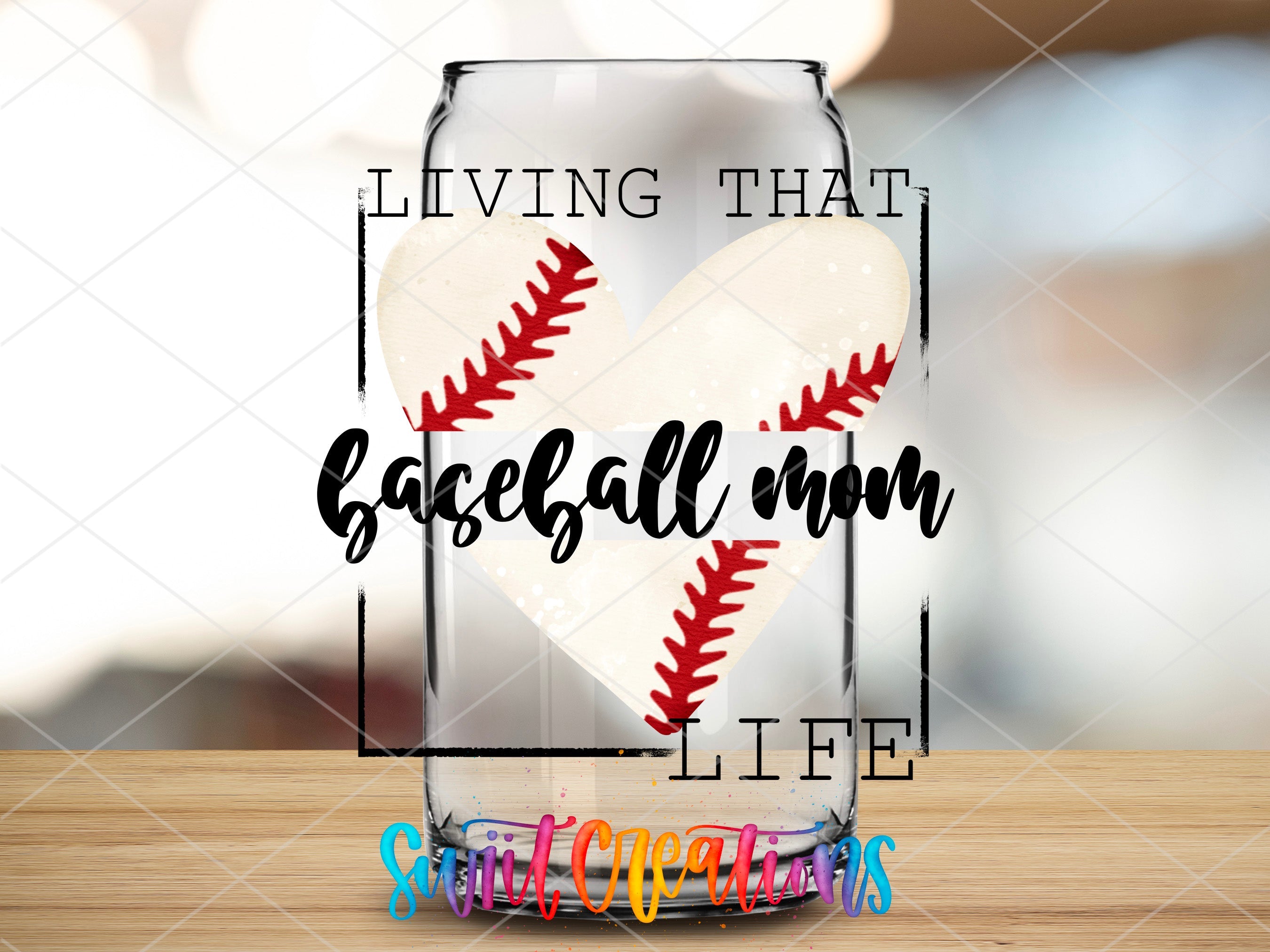 a glass jar with a baseball heart inside of it