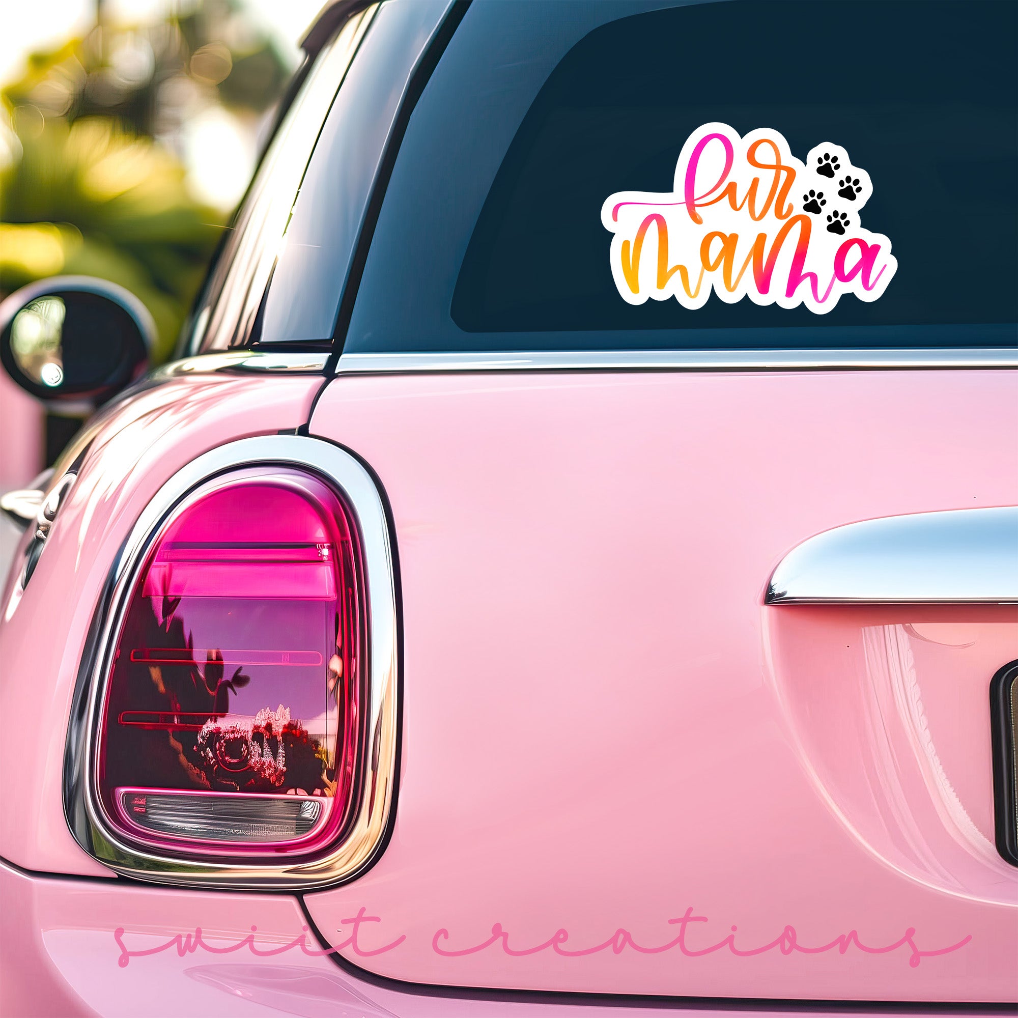 a pink car with a sticker that says girl mama