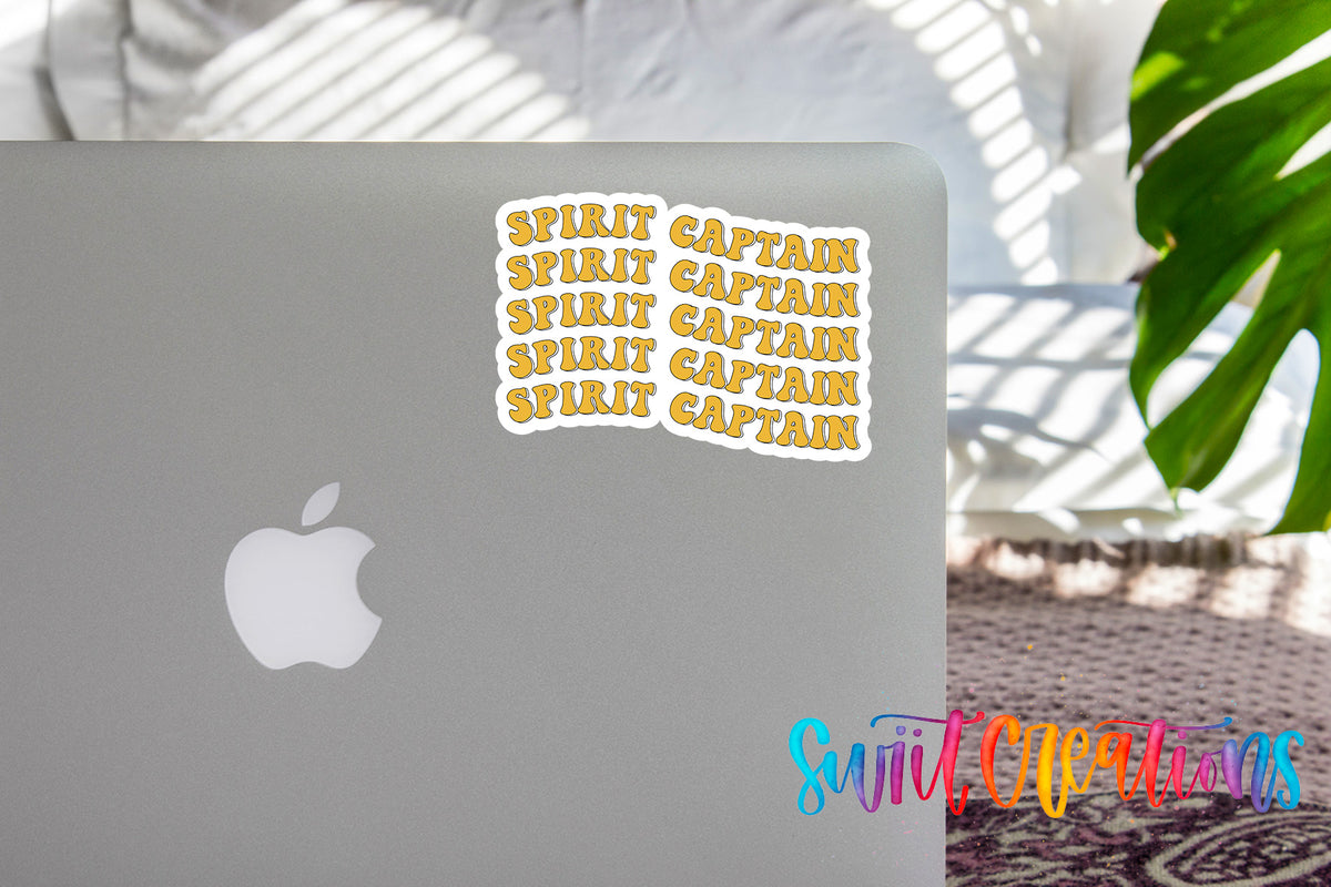 a sticker with the word "SPIRIT" repeated in a decorative pattern on the back of a silver laptop.