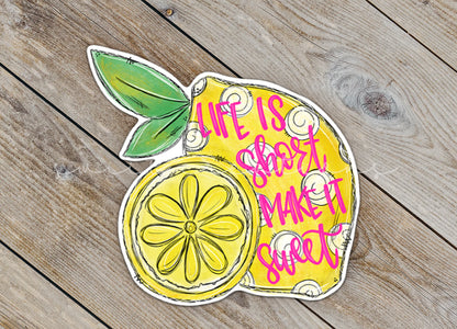 a sticker of a lemon on a wooden surface
