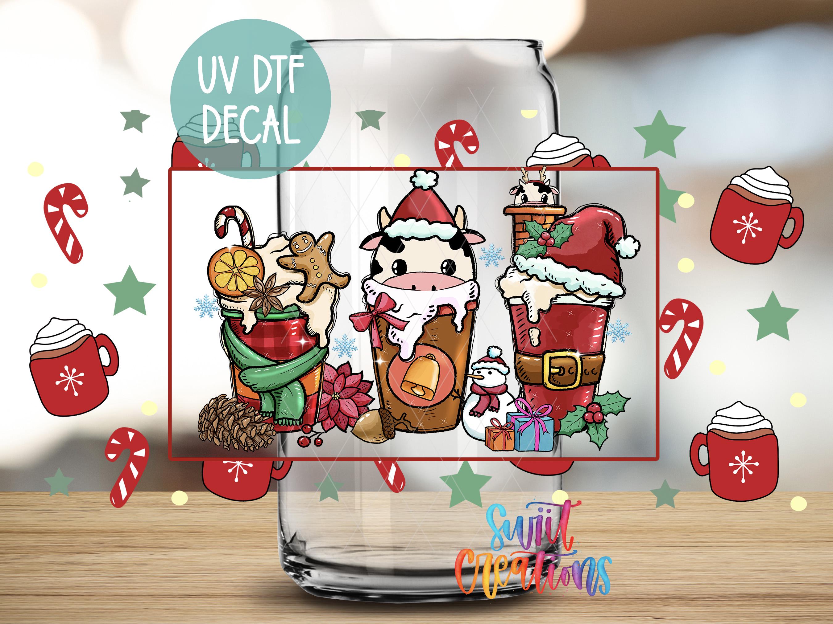 a glass with a picture of santa claus and other christmas items