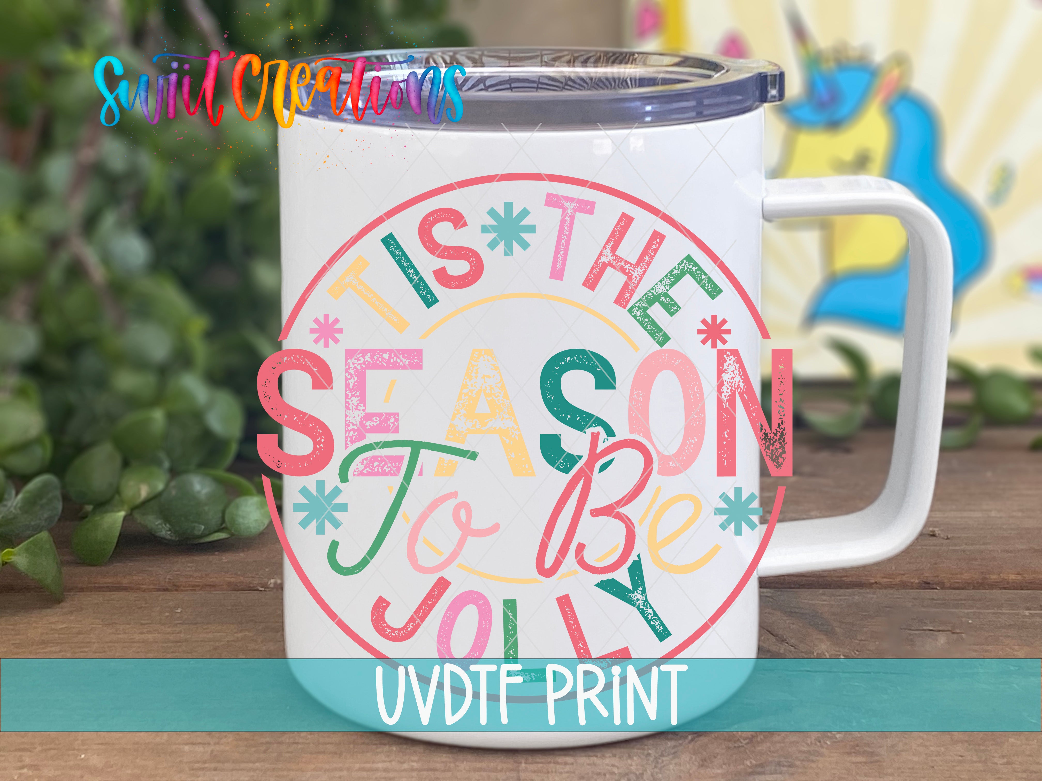 a white coffee mug with the words tis the season to be jolly on it