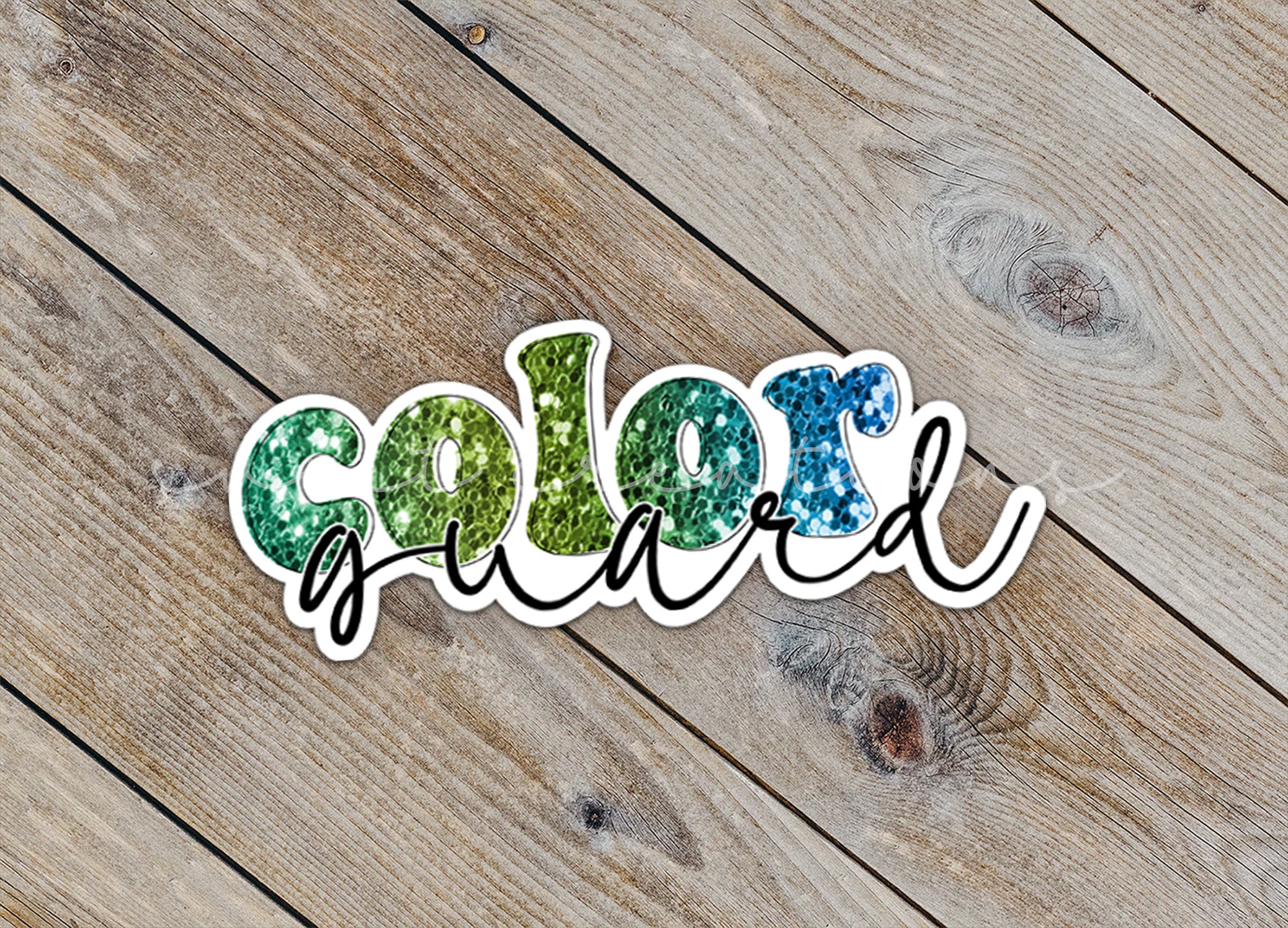a close up of a sticker on a wooden surface