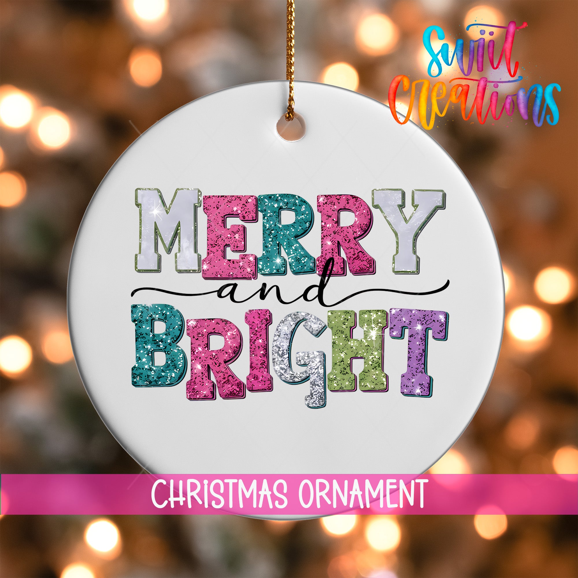 A white Christmas ornament with the text "MERRY and BRIGHT" in colorful glitter letters, hanging against a background of colorful lights.