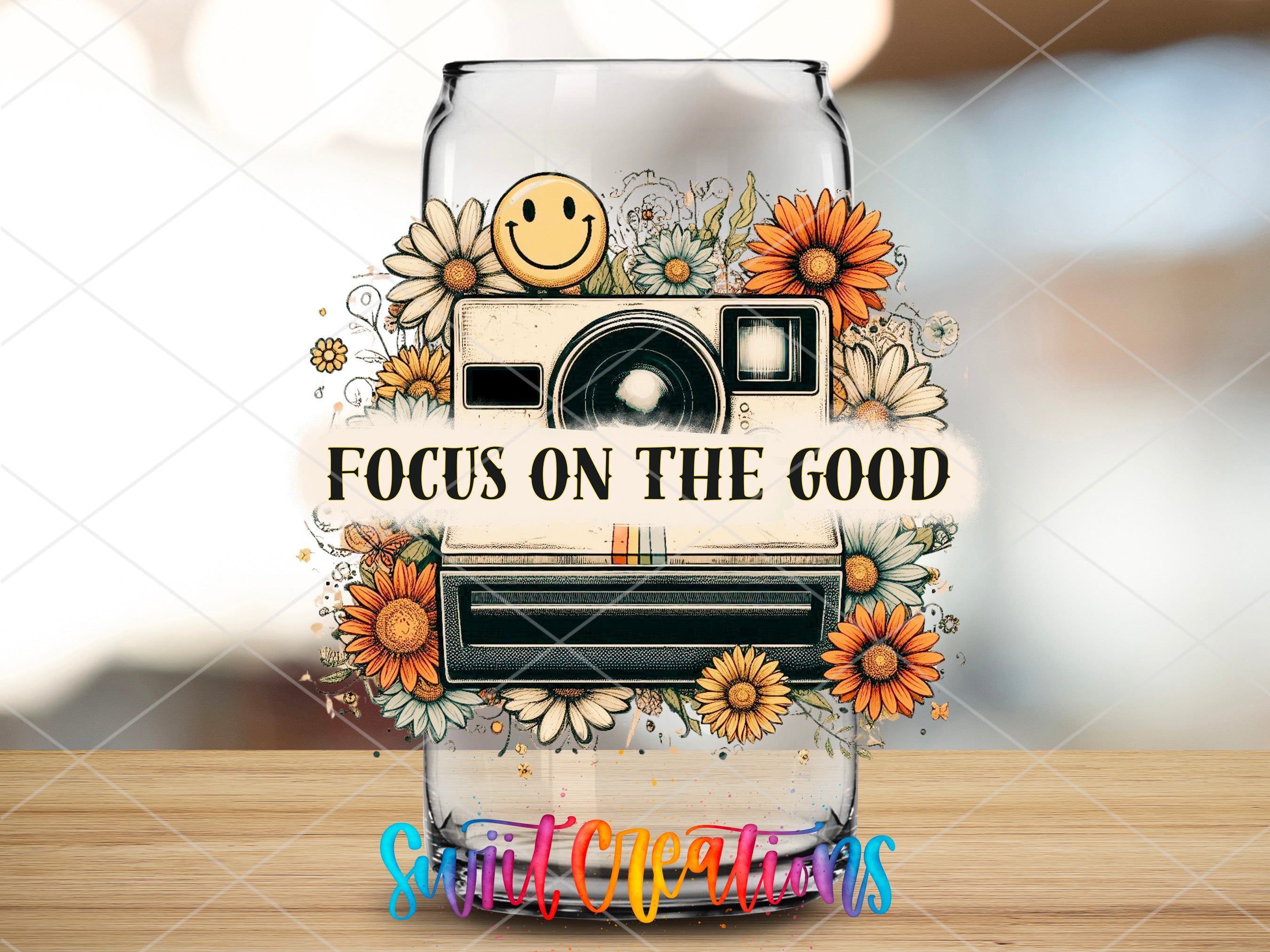 a glass jar with a picture of a camera and sunflowers
