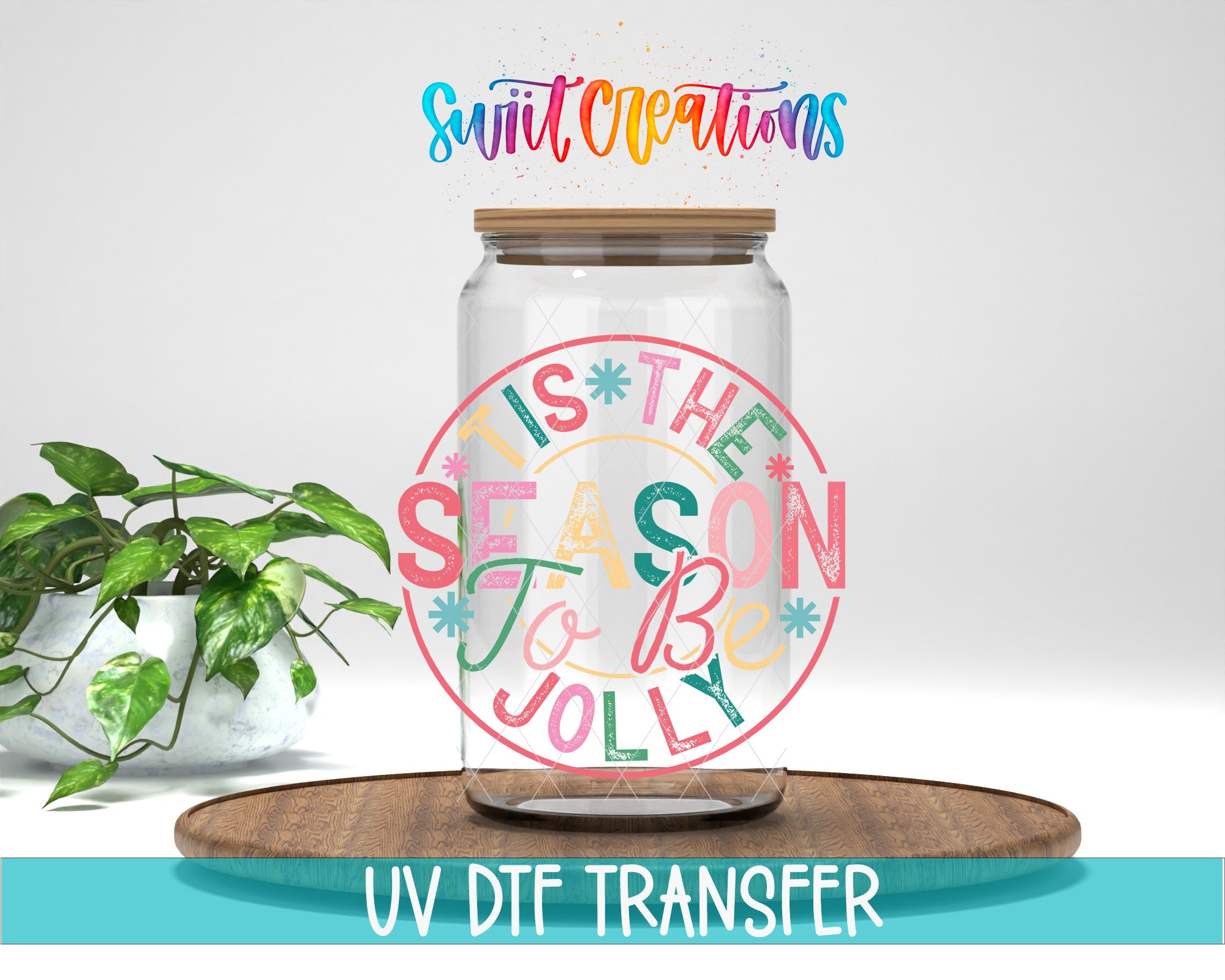 a glass jar with a colorful, festive design on it, placed on a wooden surface.