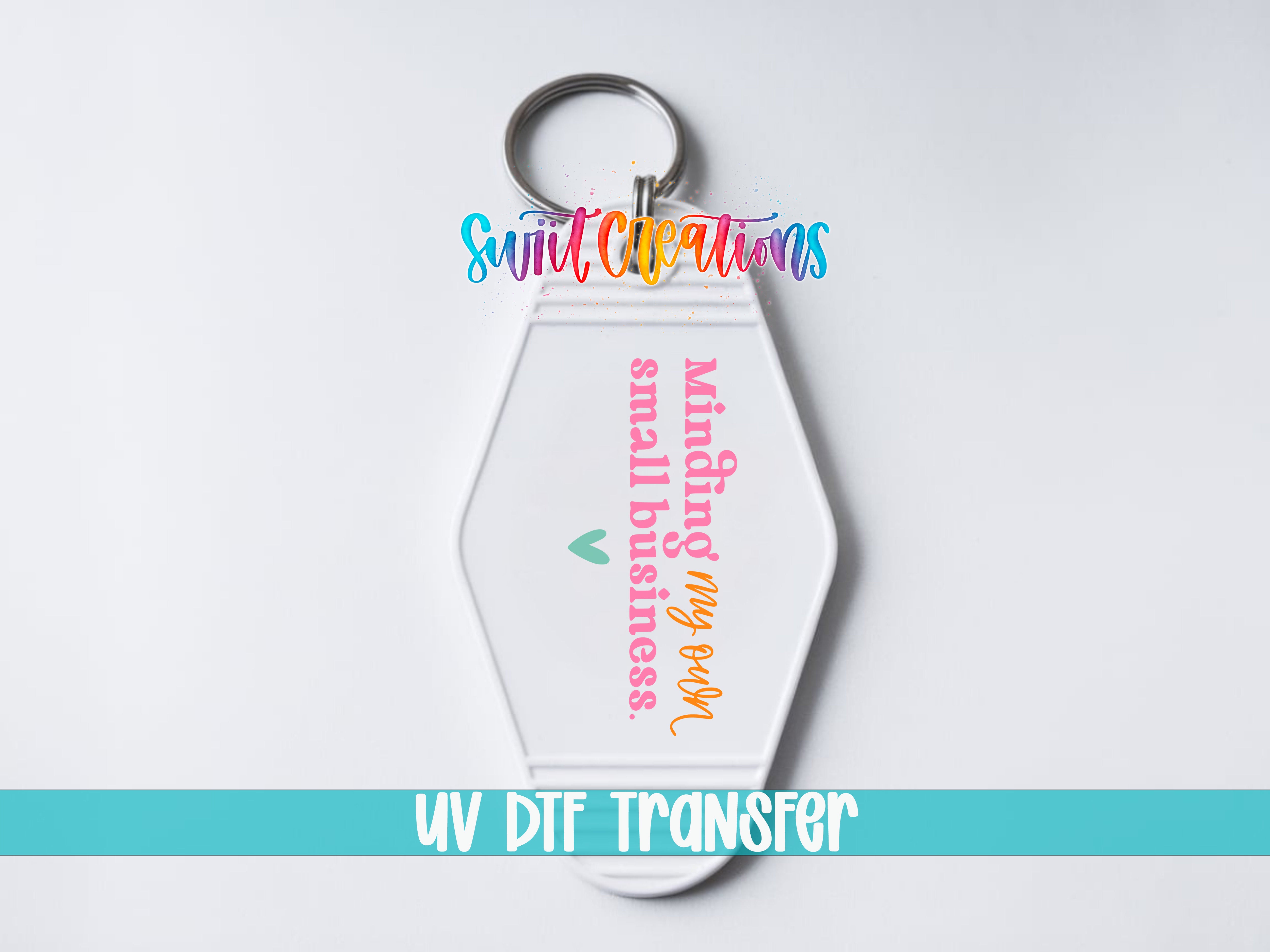 A keychain with a colorful design and text printed on it.