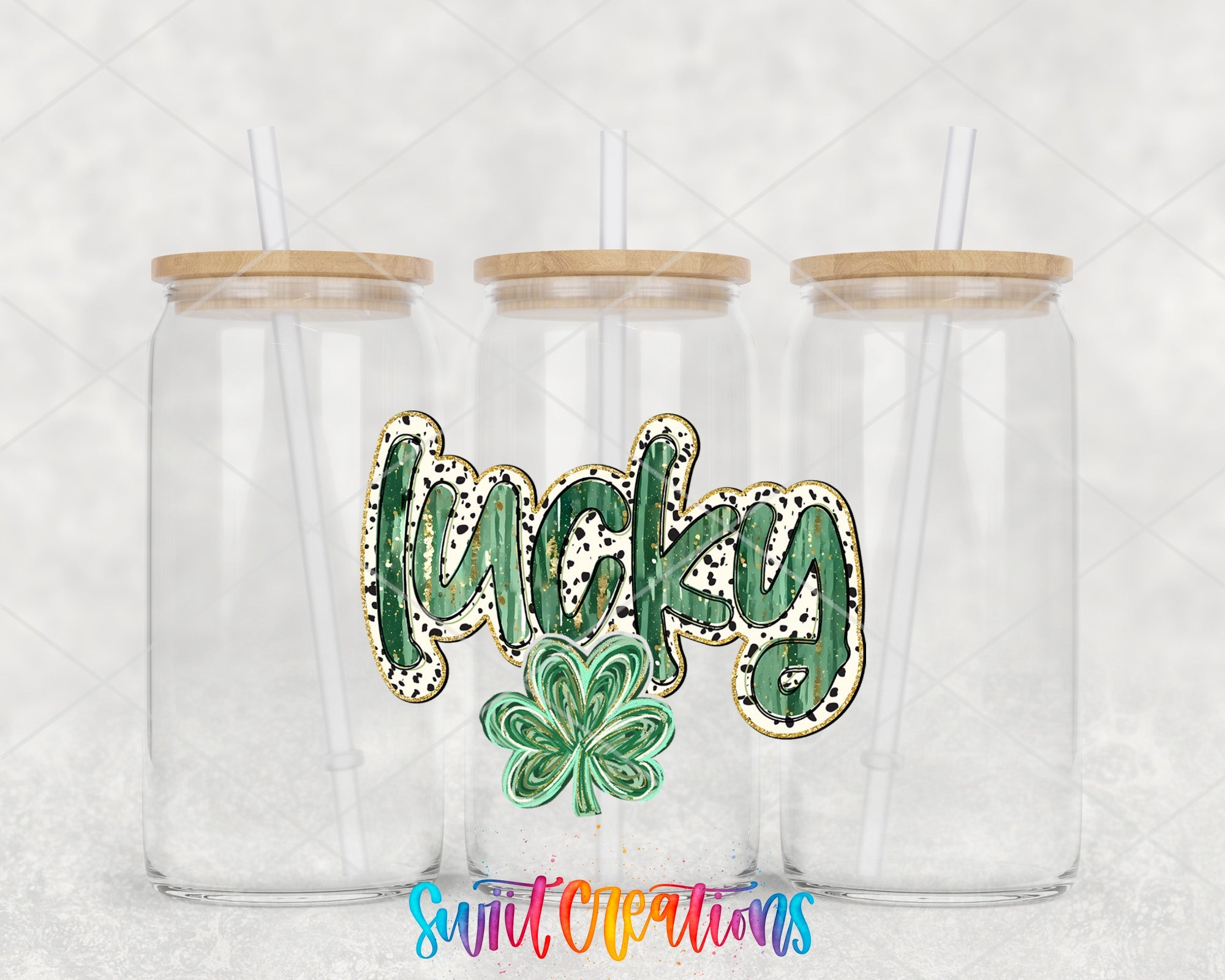 a couple of clear cups with shamrocks on them