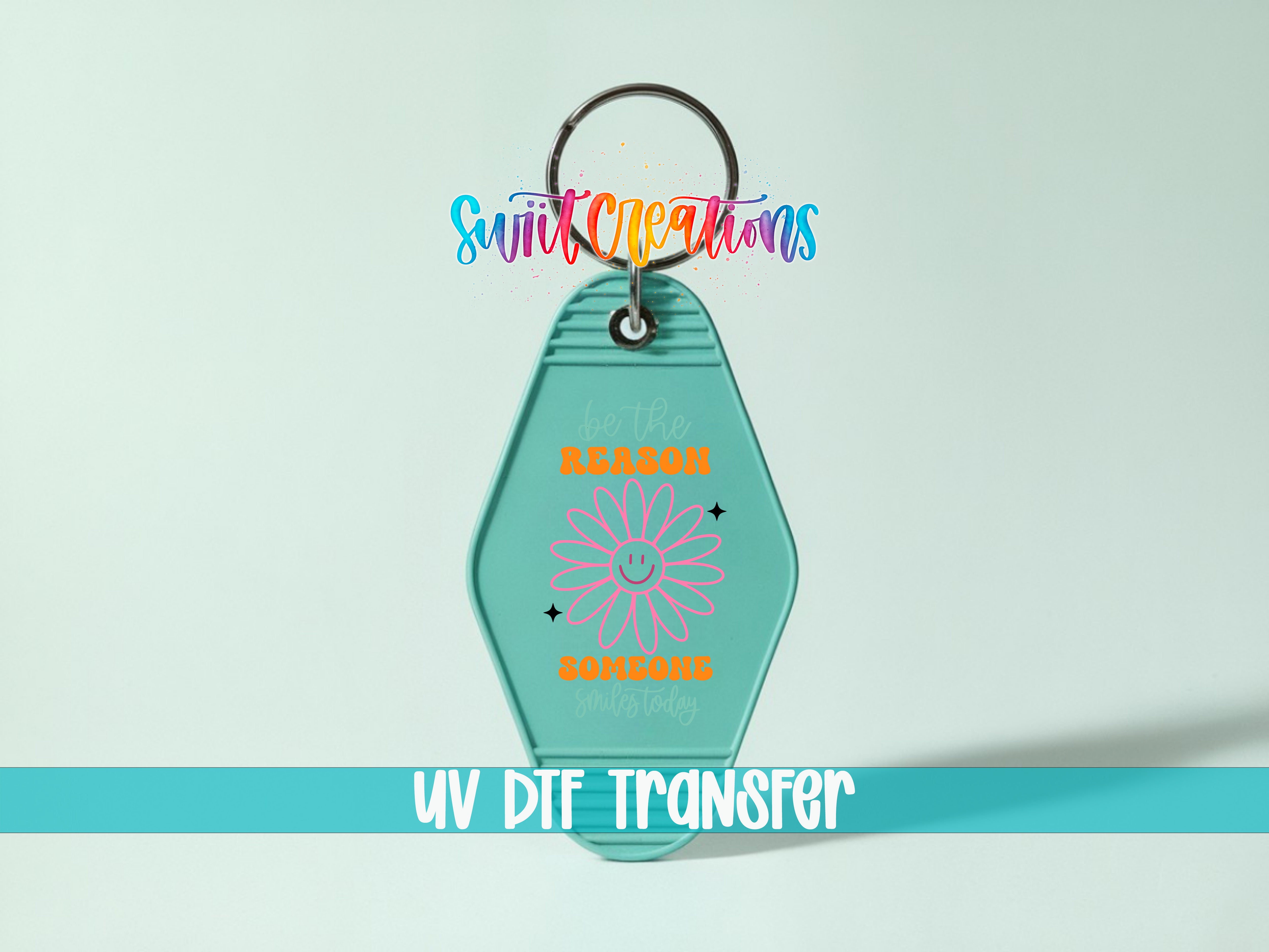 A keychain with a flower design and the text "Be the reason" printed on it.