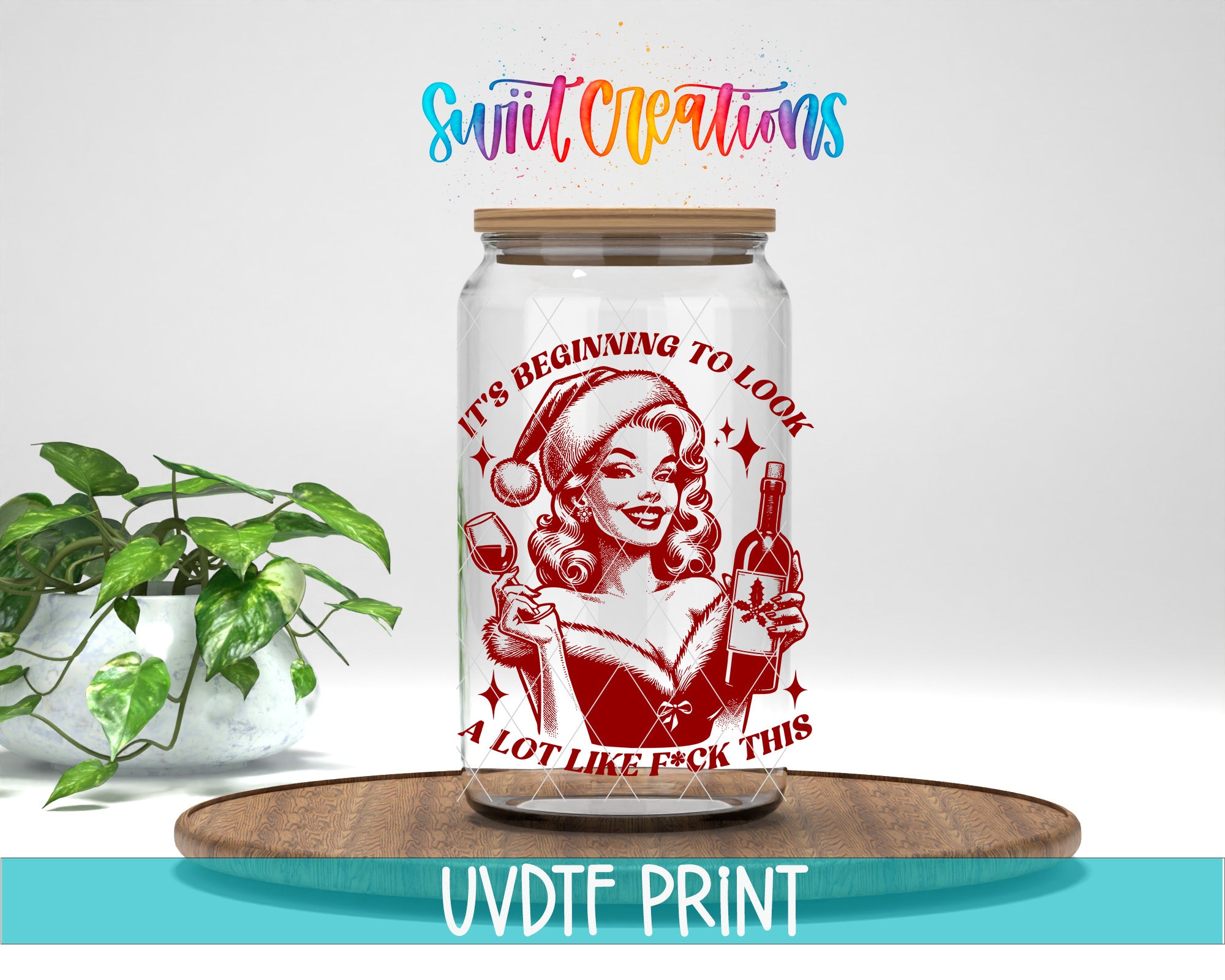 A glass jar with a red and white design featuring a woman holding a wine glass and a bottle, along with the text "It's Beginning to Look Like F*ck This" printed on it.