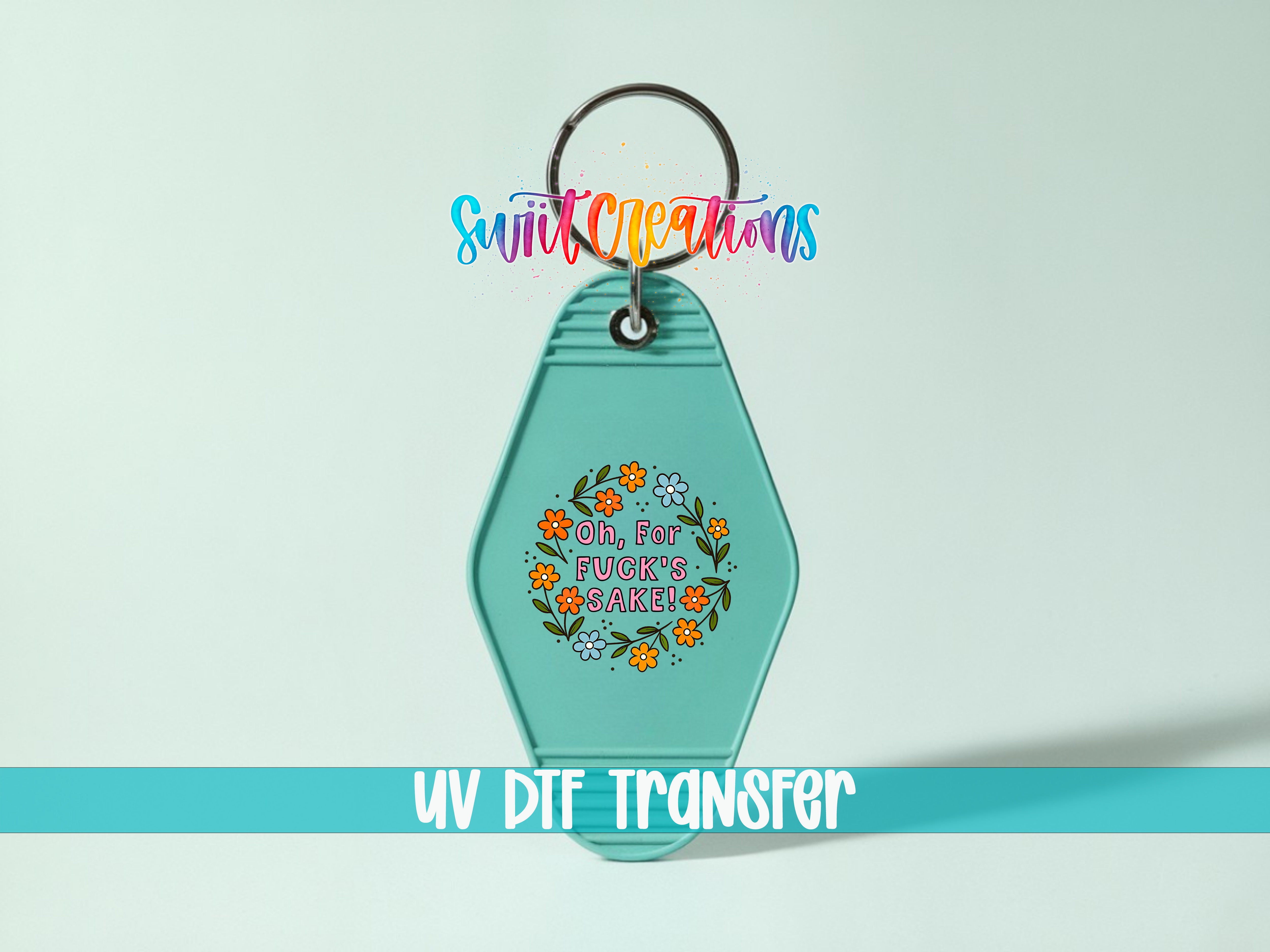 A keychain with a colorful floral design and text on it, along with a UV DIF Transfer label.