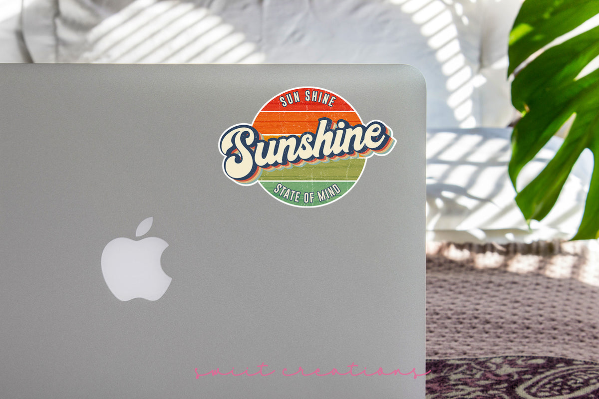 Sunshine State of Mind sticker on the lid of a silver laptop