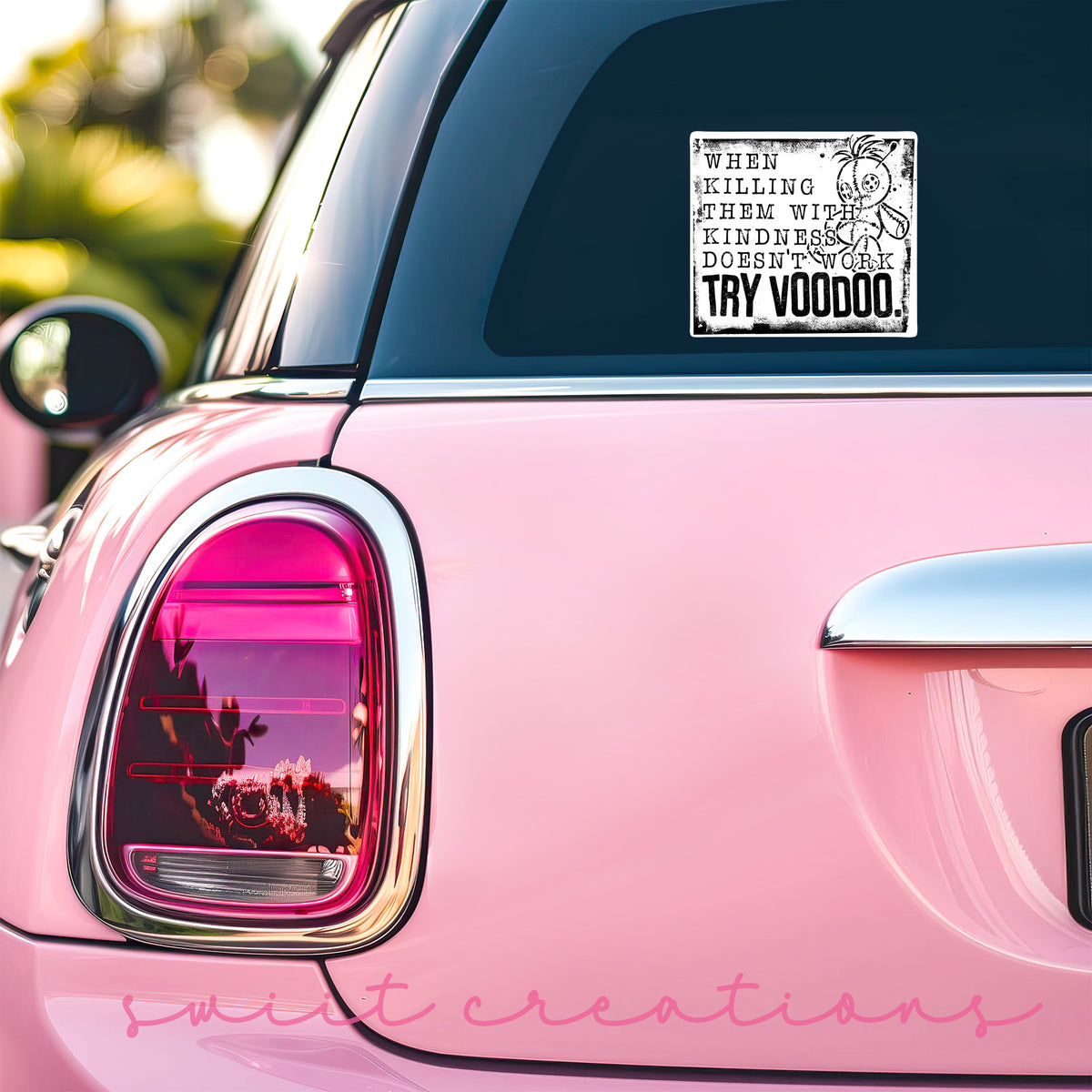 Try Voodoo sticker on the back window of a pink car